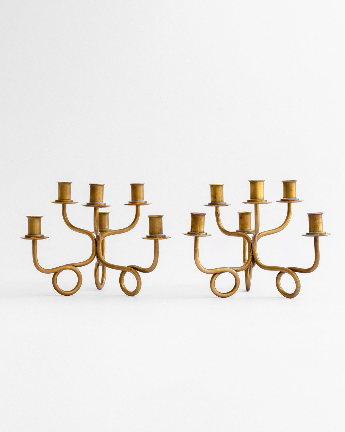 Pair of Brass Candelabra by Josef Frank, Sweden, 1940s — lifestyle setting