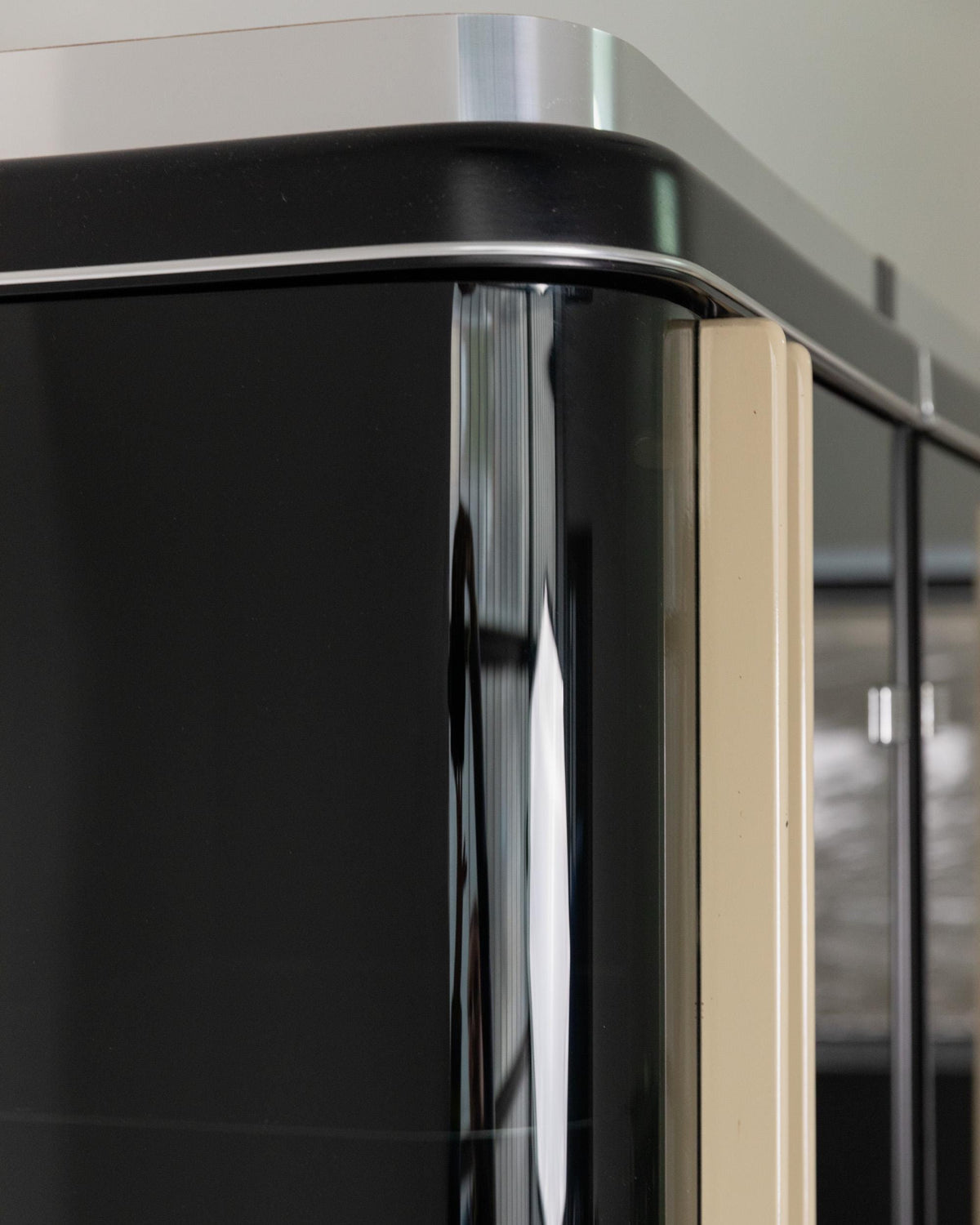 1950s Art Deco Bar Cabinet in Lacquered Wood — close-up of glossy black finish