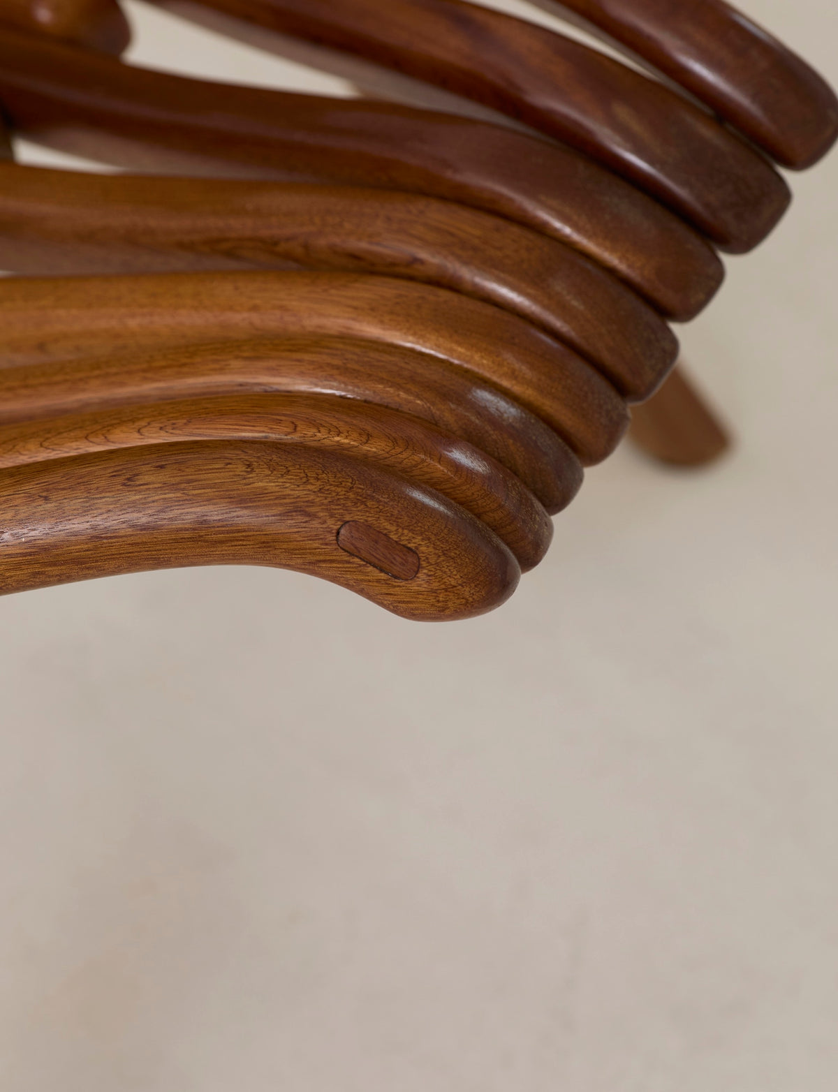 Vintage Artisanal Foldable Lounge Chair in Wood — close-up of curved wooden armrest