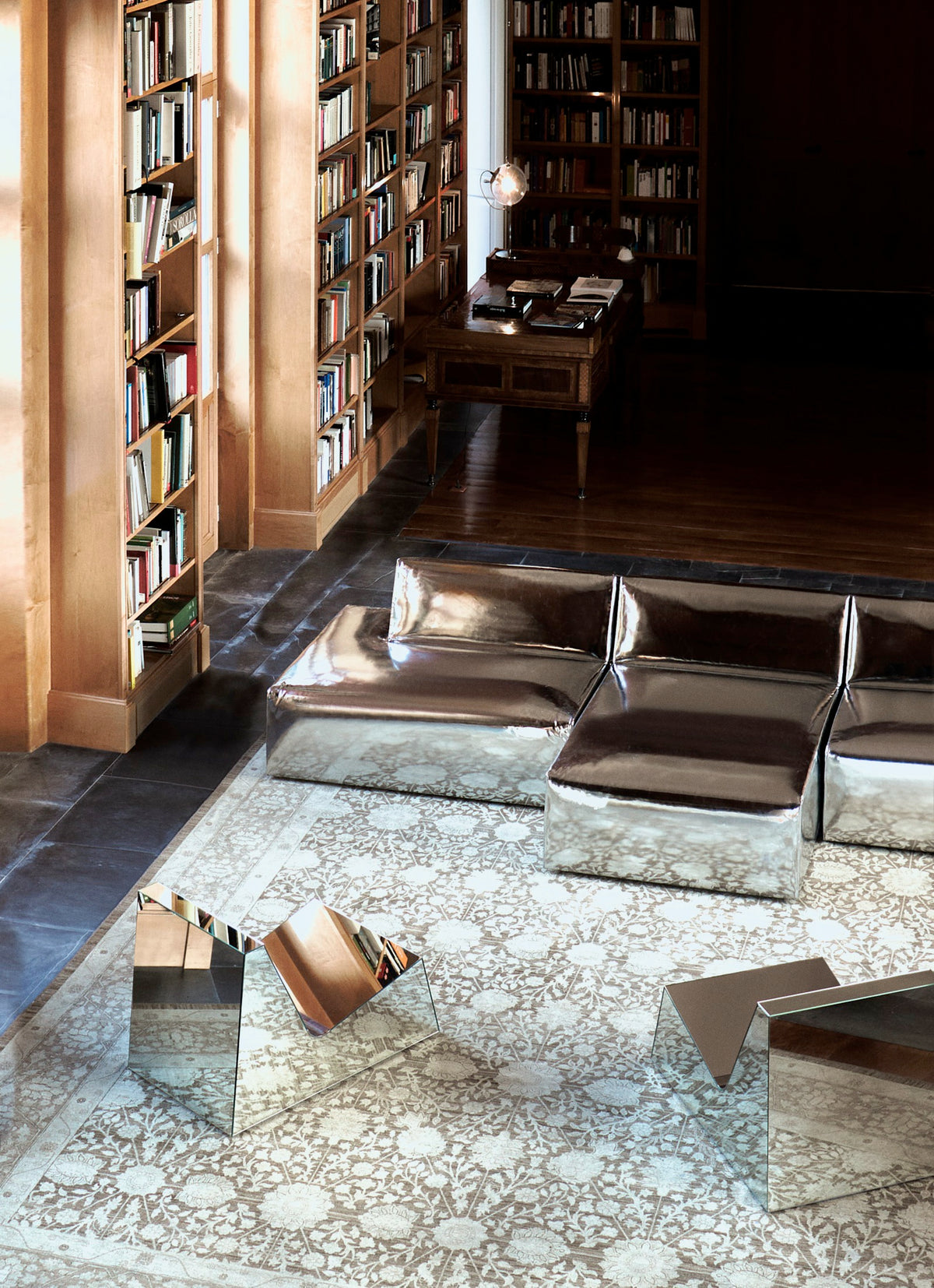 Mirror Lounge Chair — side angle in modern library setting