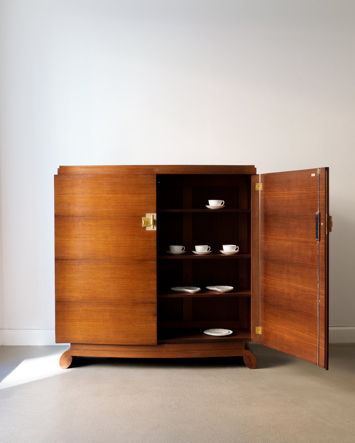 1930s Jules Leleu teak cabinet open showing interior shelves