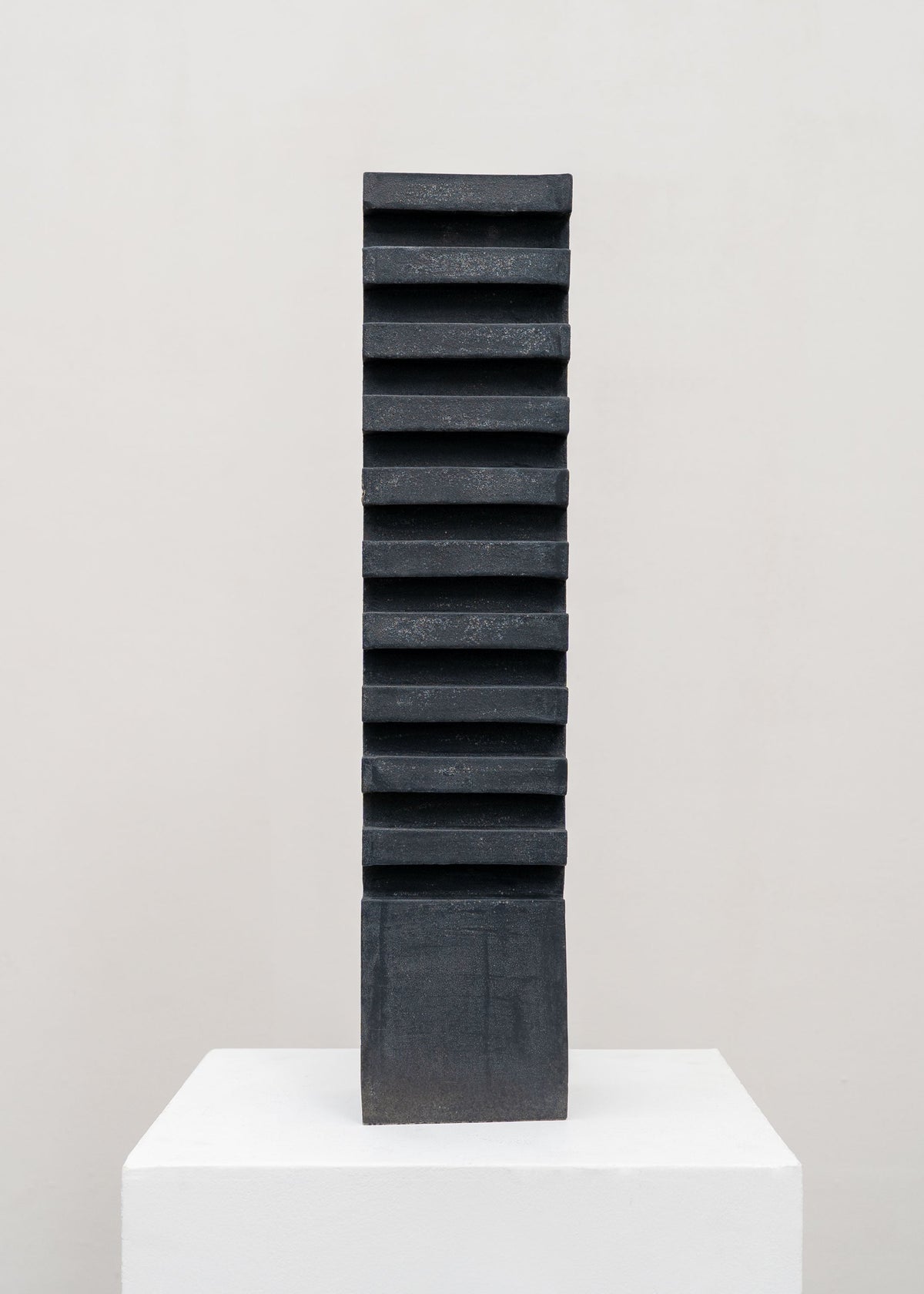 Tall Sculptural Stoneware Vessel by Tom Roberts — side angle showing textured black surface