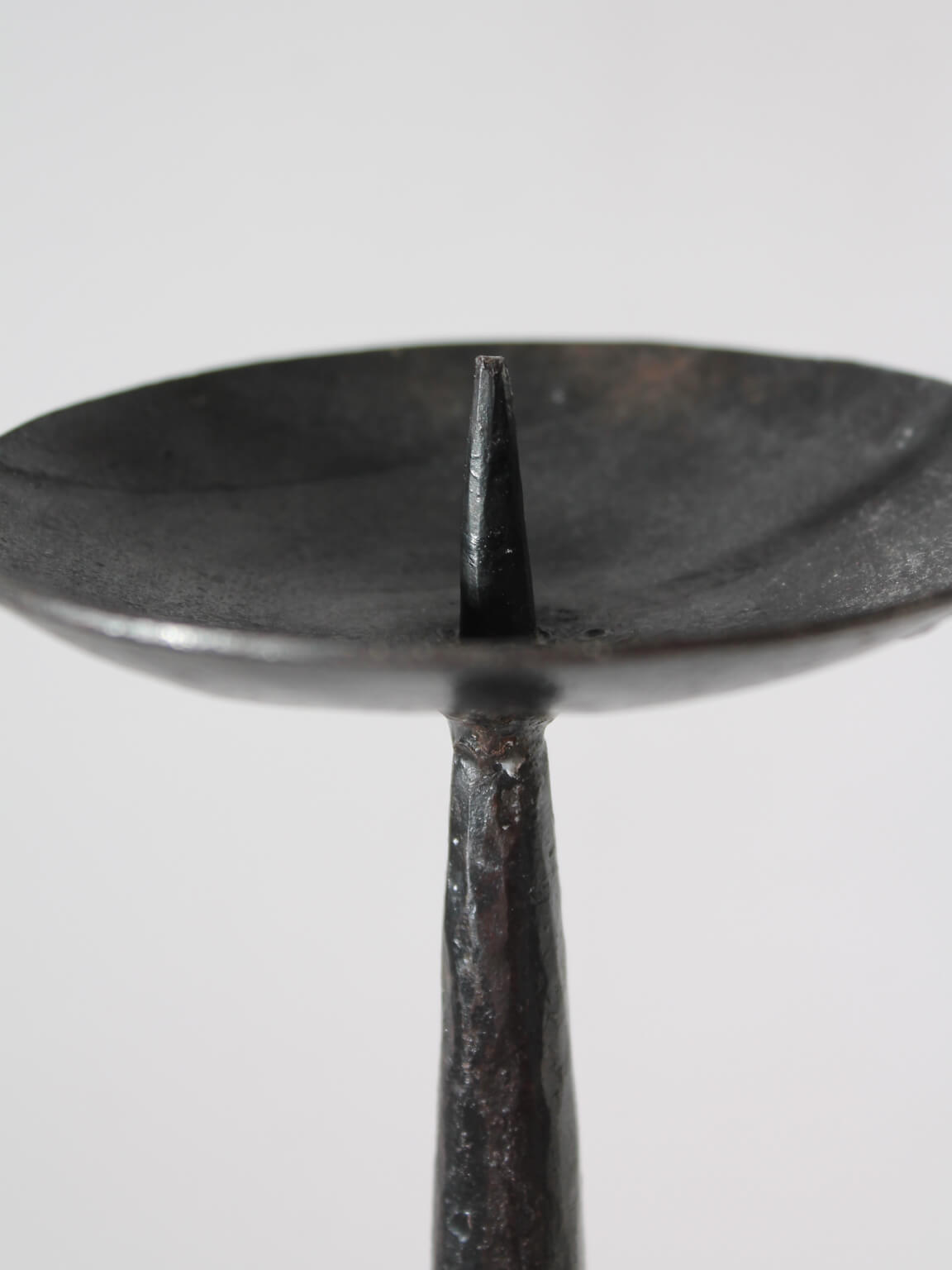 Cast Iron Black Floor Candle Holder — top view of textured black surface