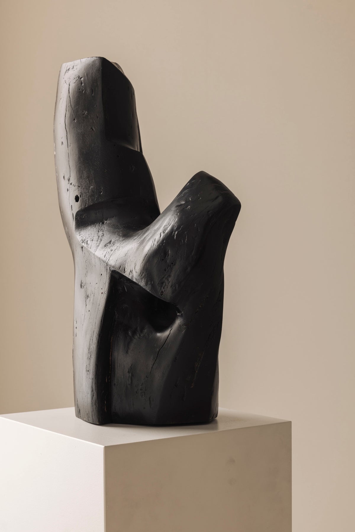 Abstract sculpture in solid dark stained wood dating from the 1950s. — side angle