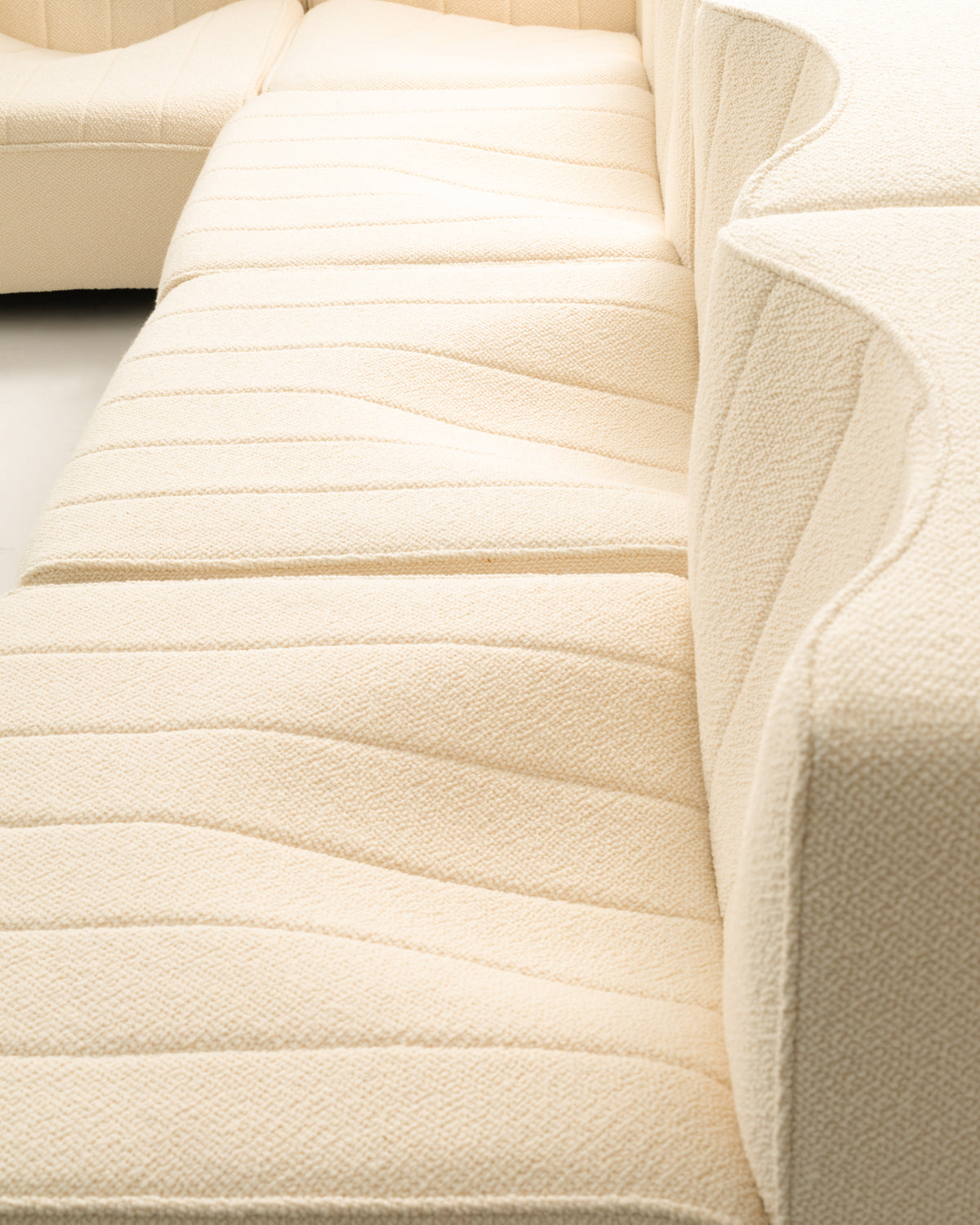 Cream fabric upholstery detail of Tito Agnoli modular sofa