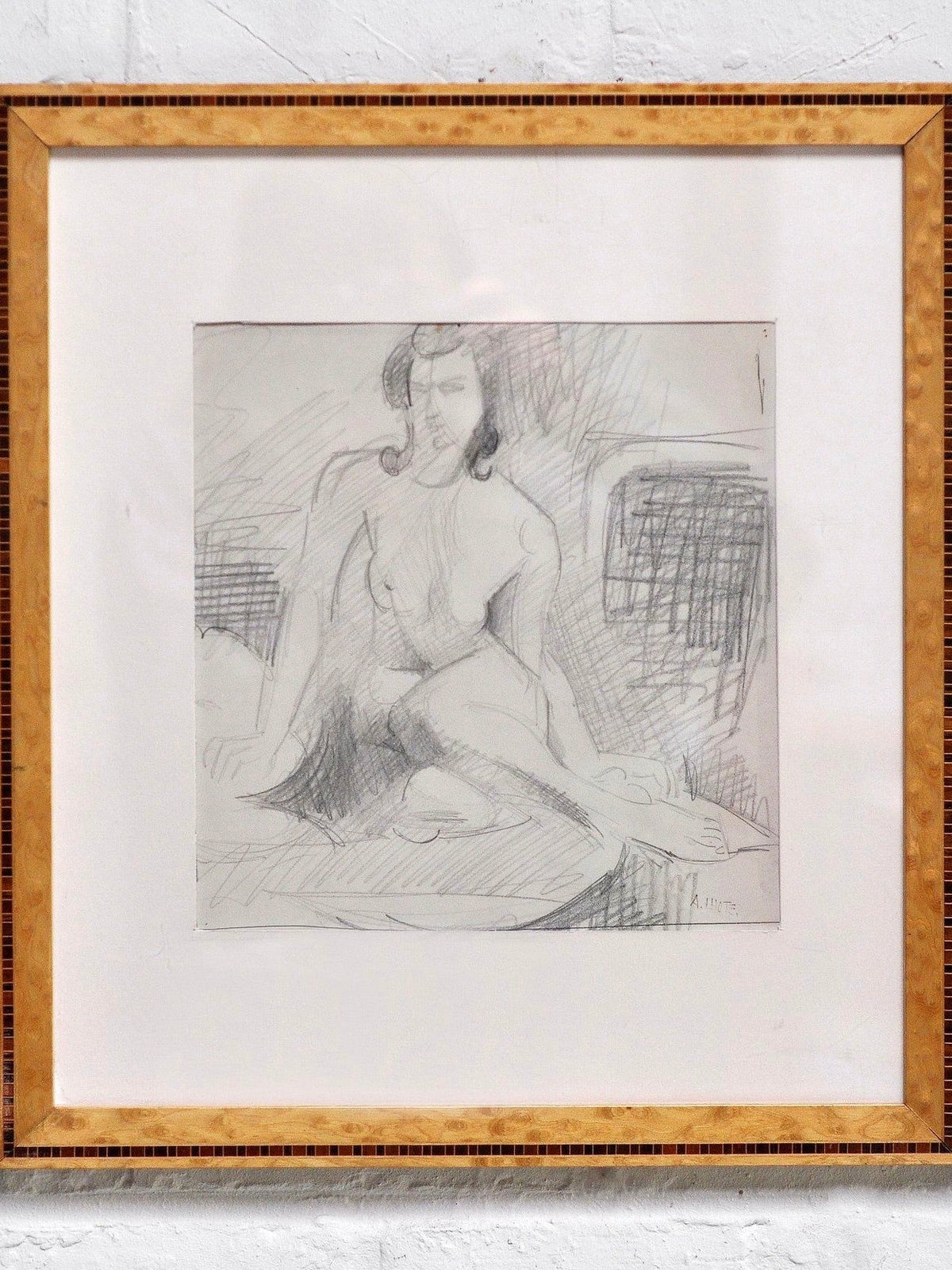 The Introverso André Lhote (1885–1962) Drawing in Pencil features a nude woman seated on a bed, rendered with loose, expressive lines and a shaded background. Matted and shown against a light-colored wall.