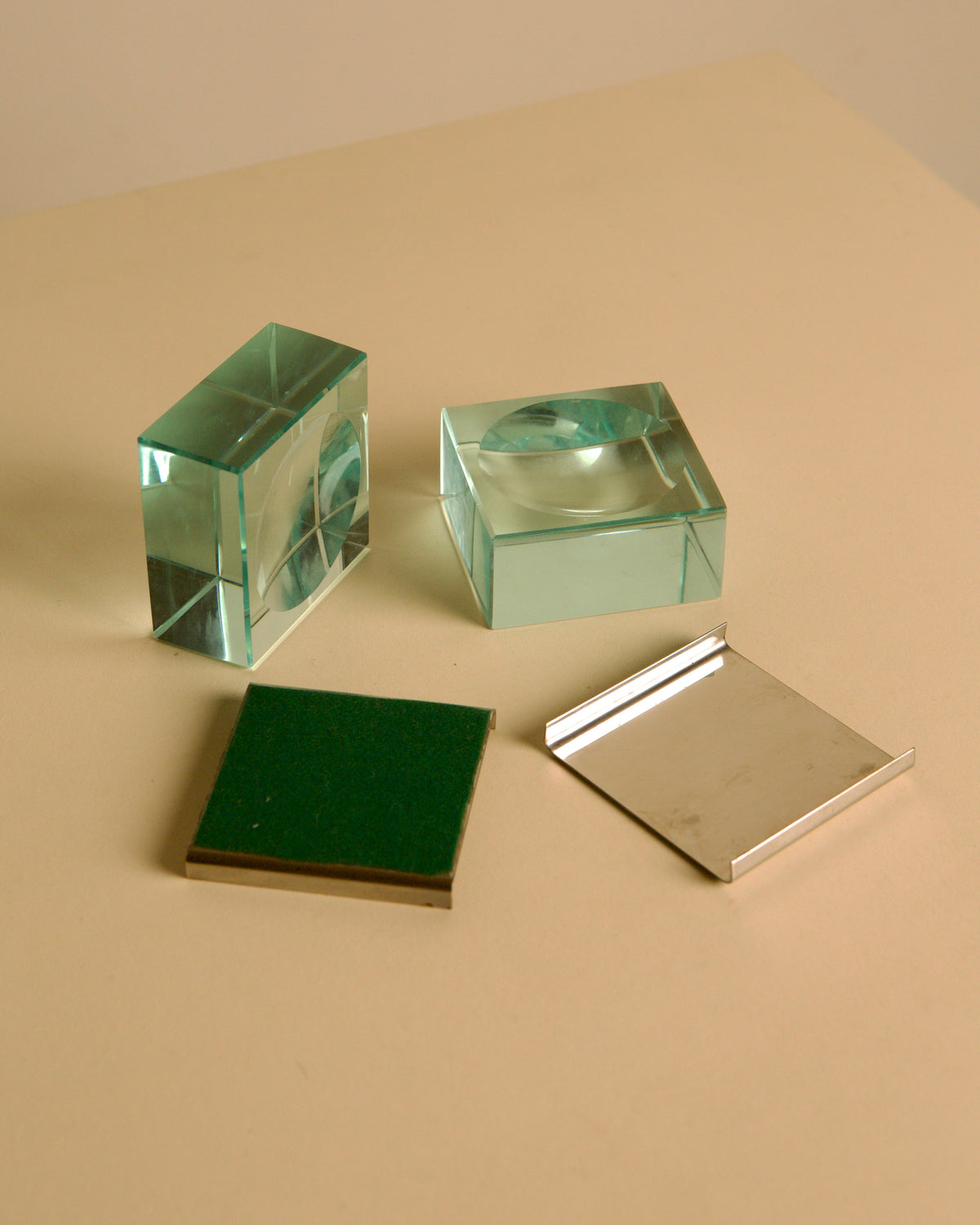 Pair of glass and metal ashtrays by Fontana Arte, 1960s — close-up