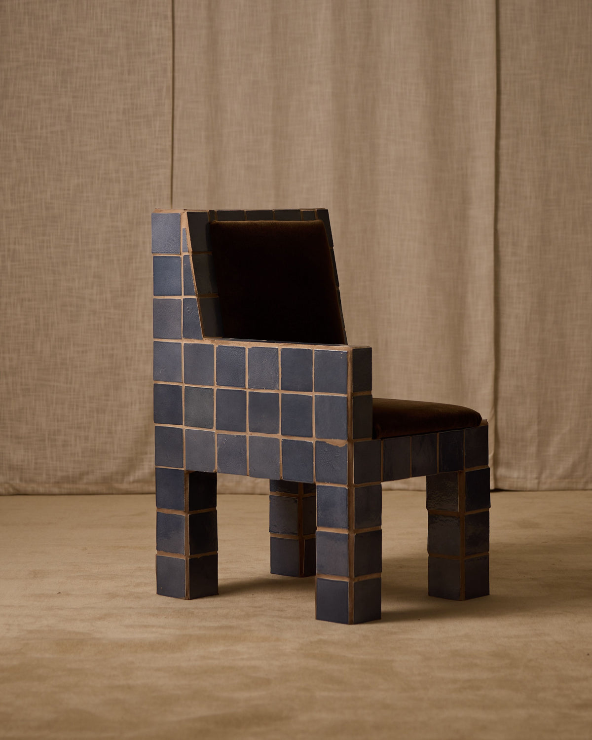Jura tiled accent chair with pixelated blue ceramic blocks design