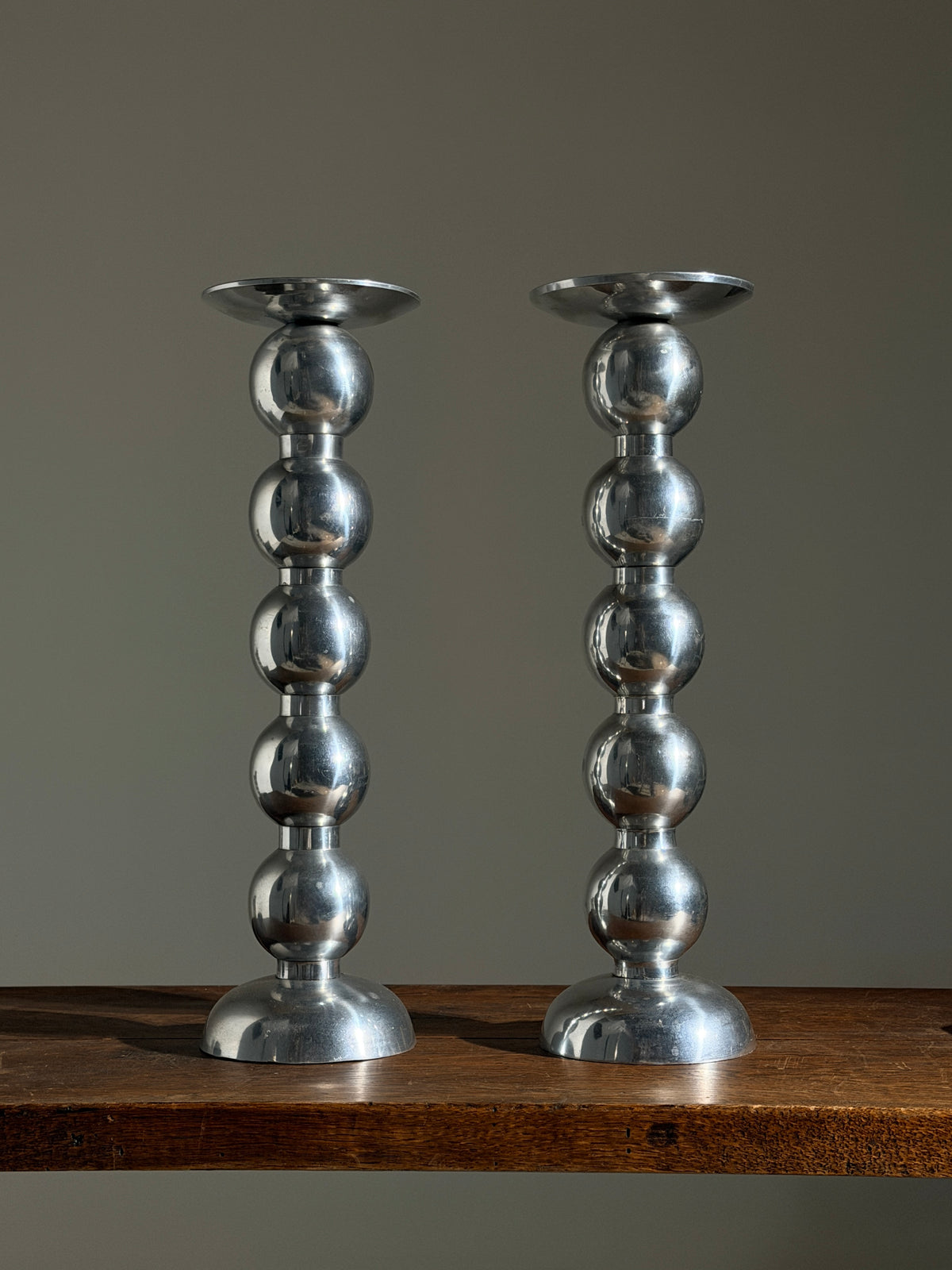 Pair of large aluminum candlesticks, France, circa 1970. — detail view