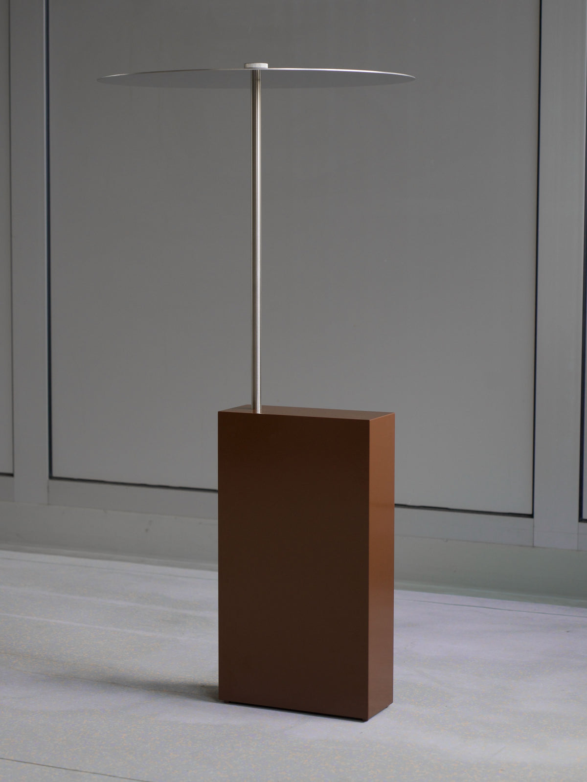 The Assistant' Side Table — side view of brown base and metal top
