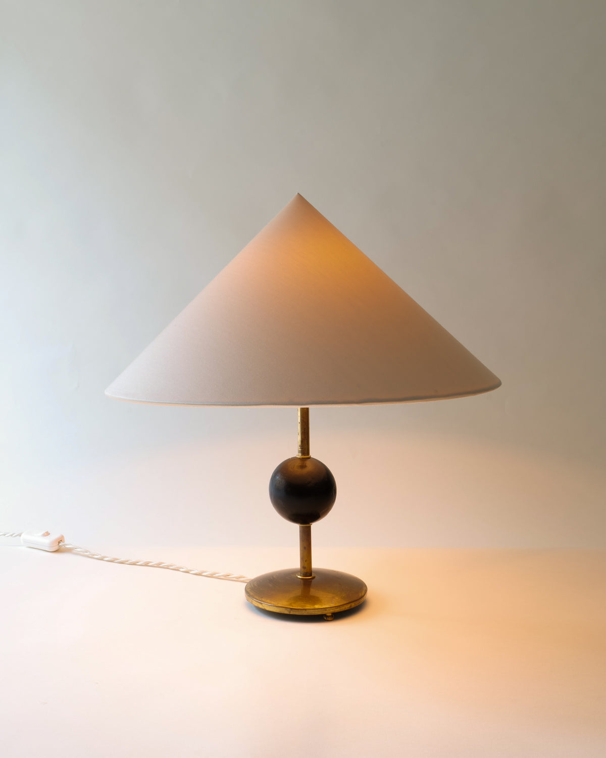 Harald Notini brass table lamp with conical shade, 1940s design