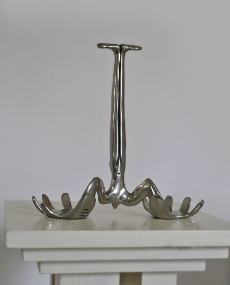 Carrol Boyes Sculptural Bottle Holder in Polished Metal by Porter Studio | The Oblist