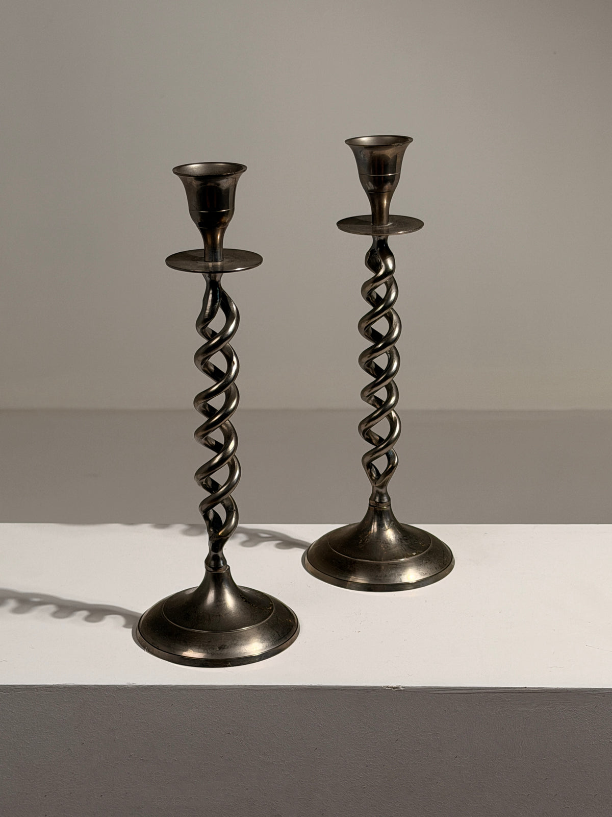 Pair of Art Deco style candlesticks — side angle