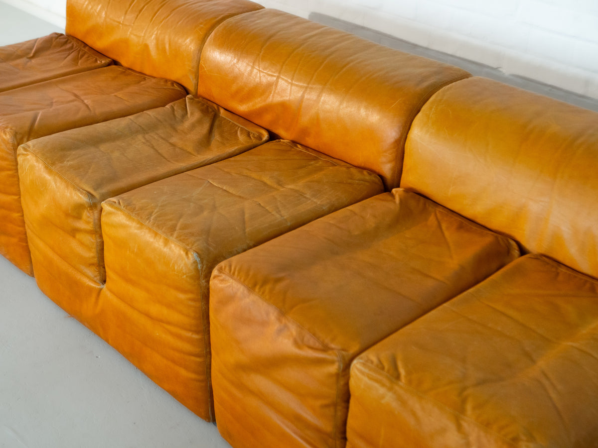 Tan leather Ipercubo modular sofa showing worn patina detail