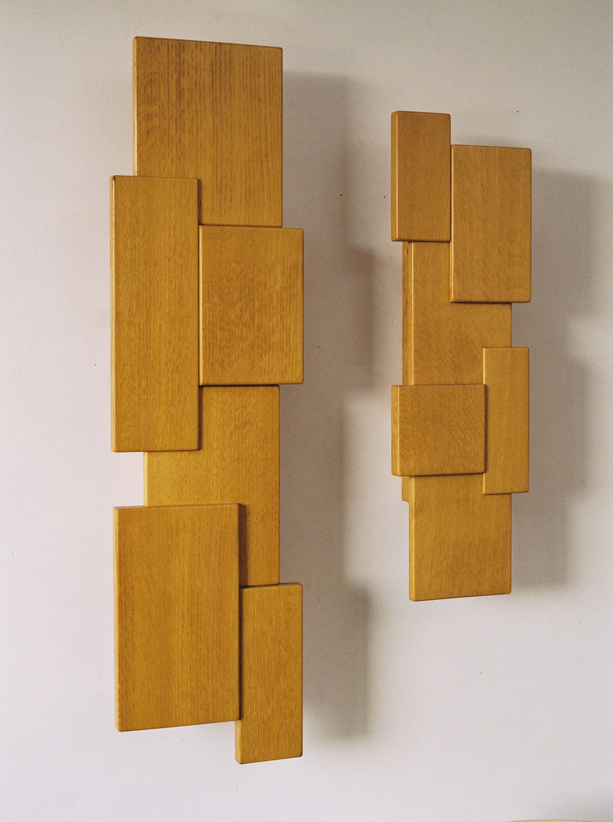 Vintage Set of Two French Oak Wood Sculptural Lamps Wall Lights C. 1980 — side angle showing geometric wooden shapes on wall