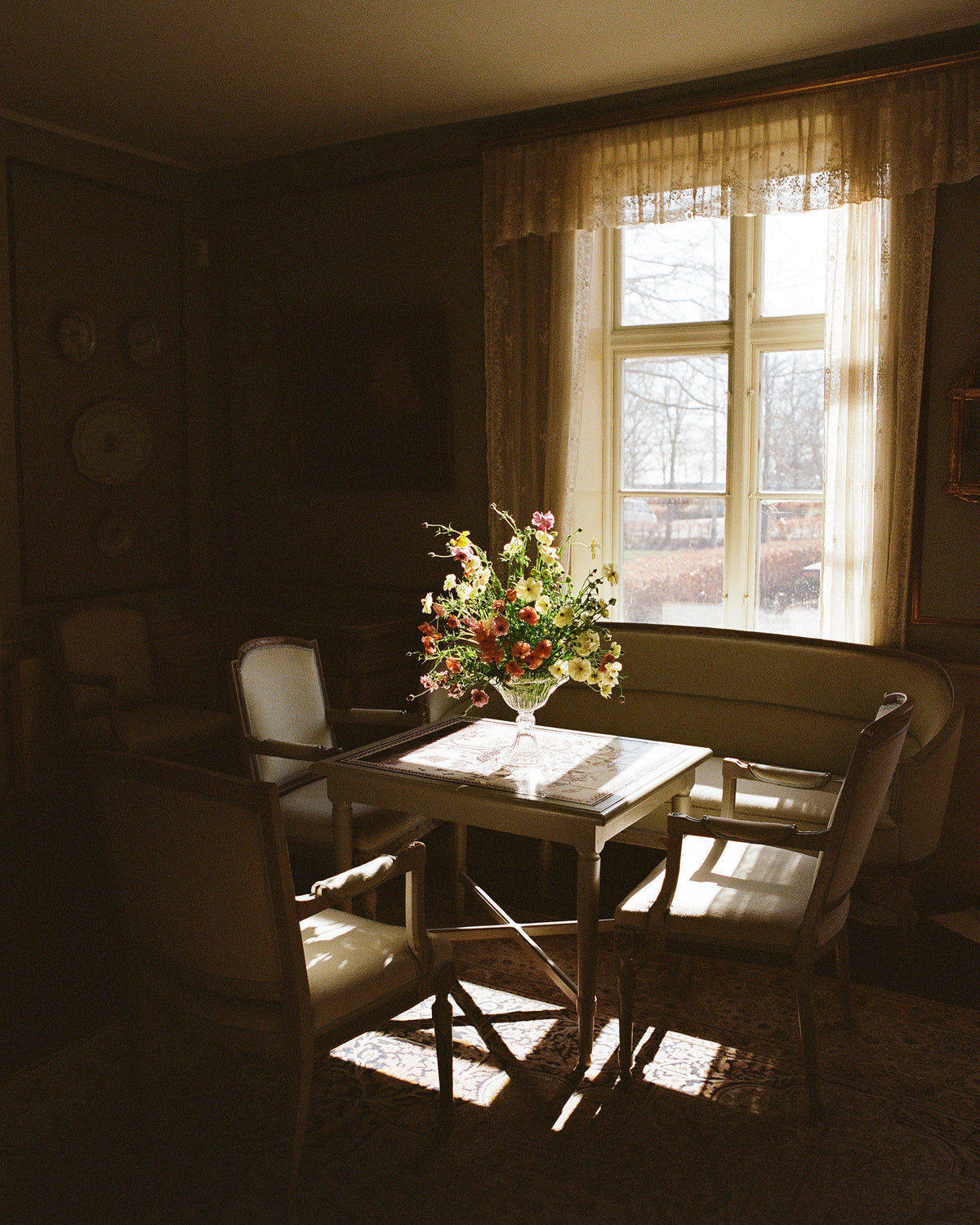 Blixen Vase Large — positioned on table with floral arrangement