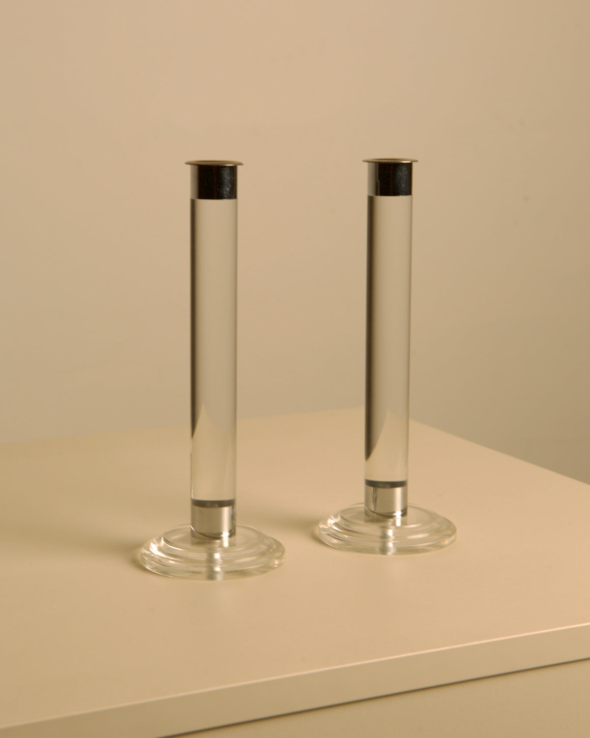 Pair of Italian lucite and silver candleholders from the 1980s