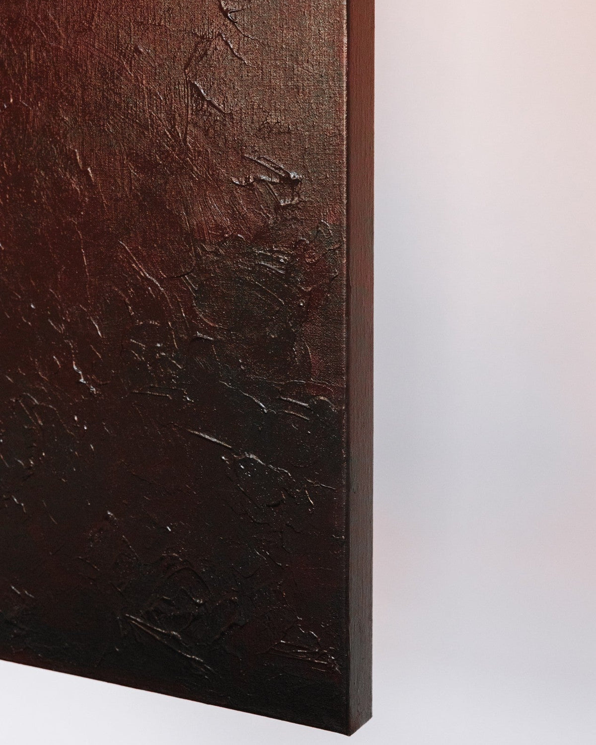 Close-up detail of textured brushstrokes in dark wine tones