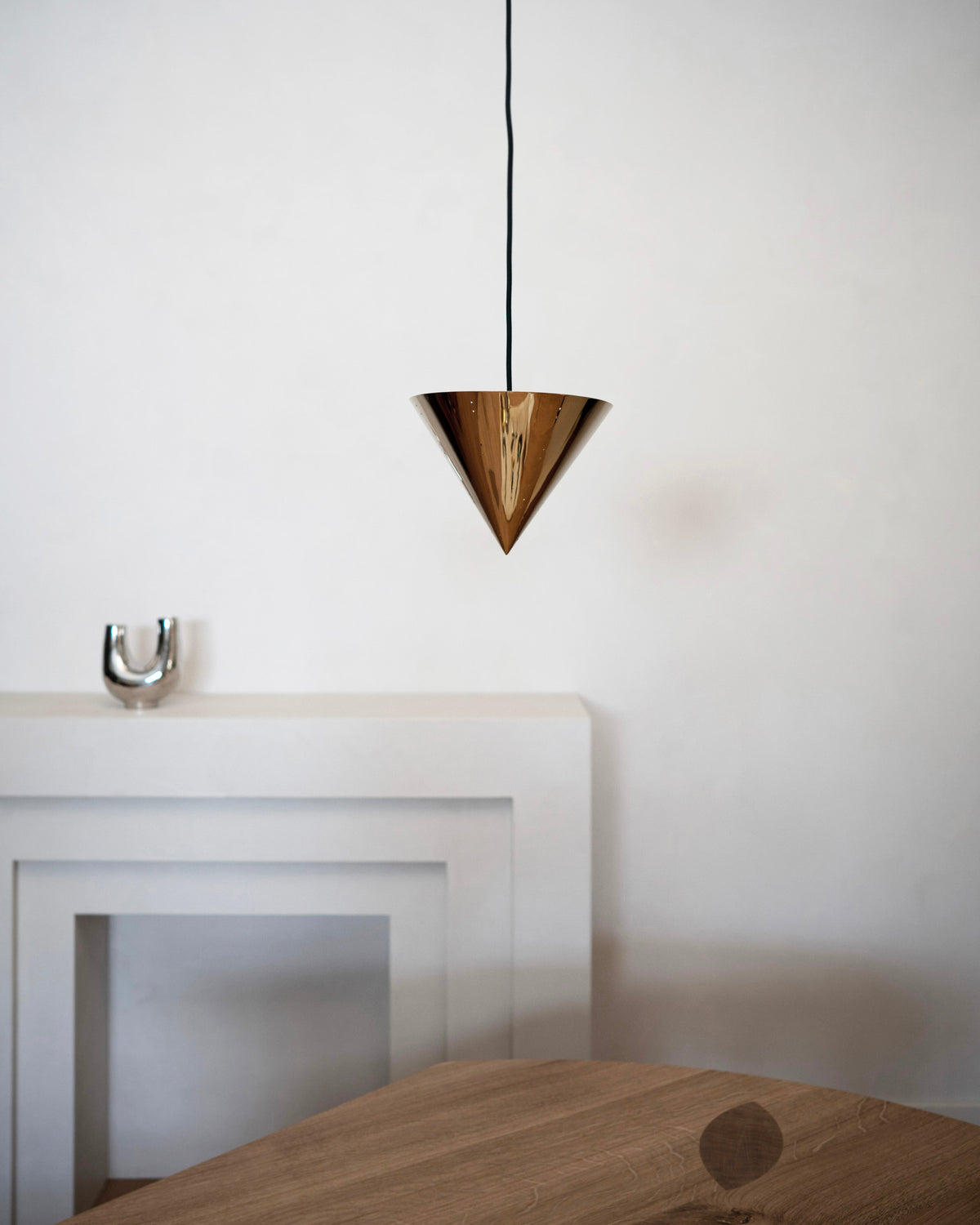 October Ceiling Lamp - Polished Steel — close-up of polished steel cone shape