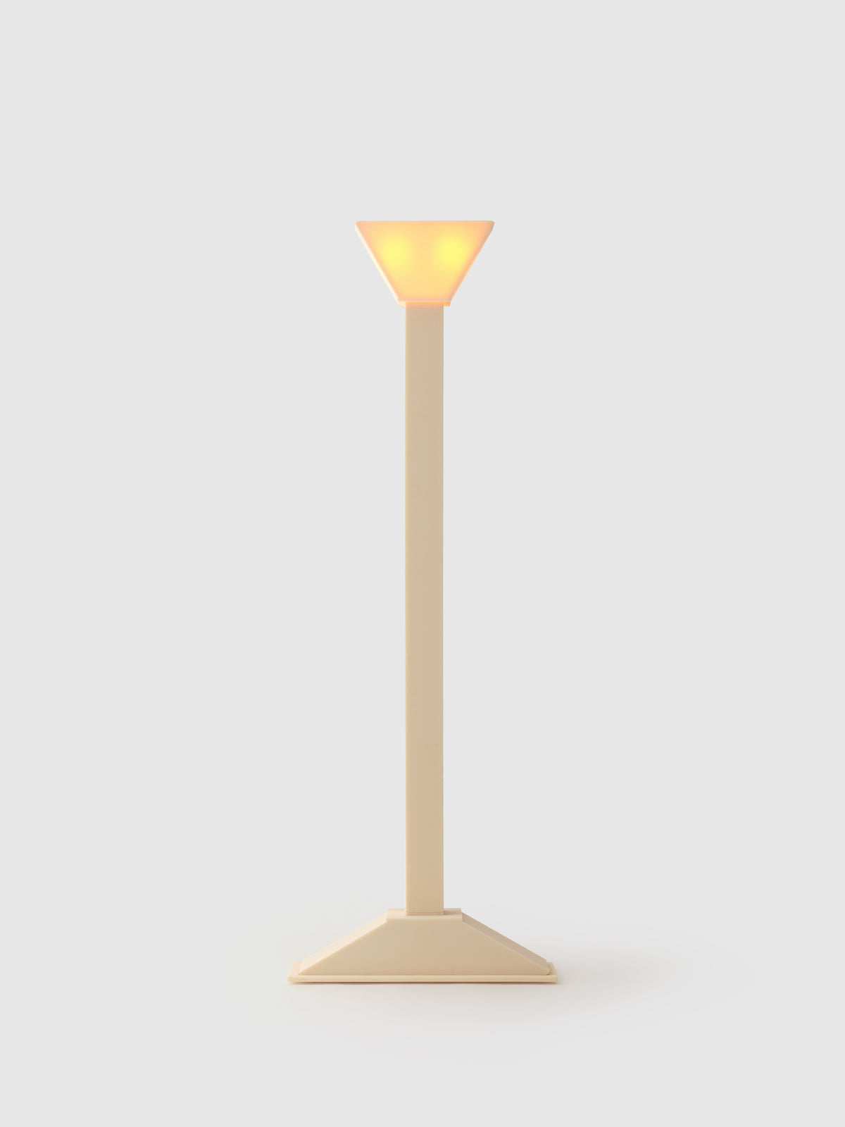Minimalist beige floor lamp with conical shade and geometric base