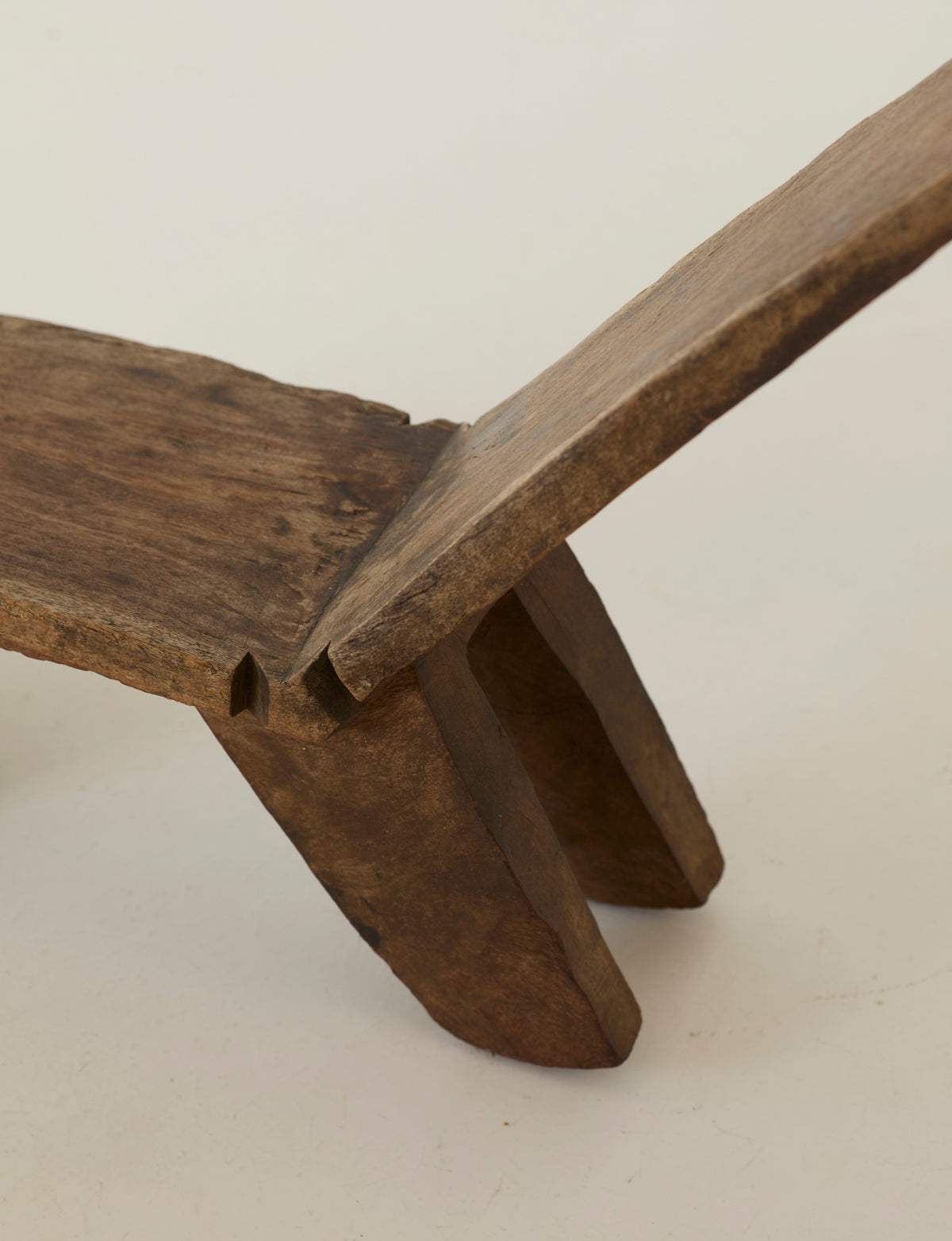 West African Monoxyle Lobi / Stargazer Chair, C. 1950 — angled view of handcrafted wooden seat