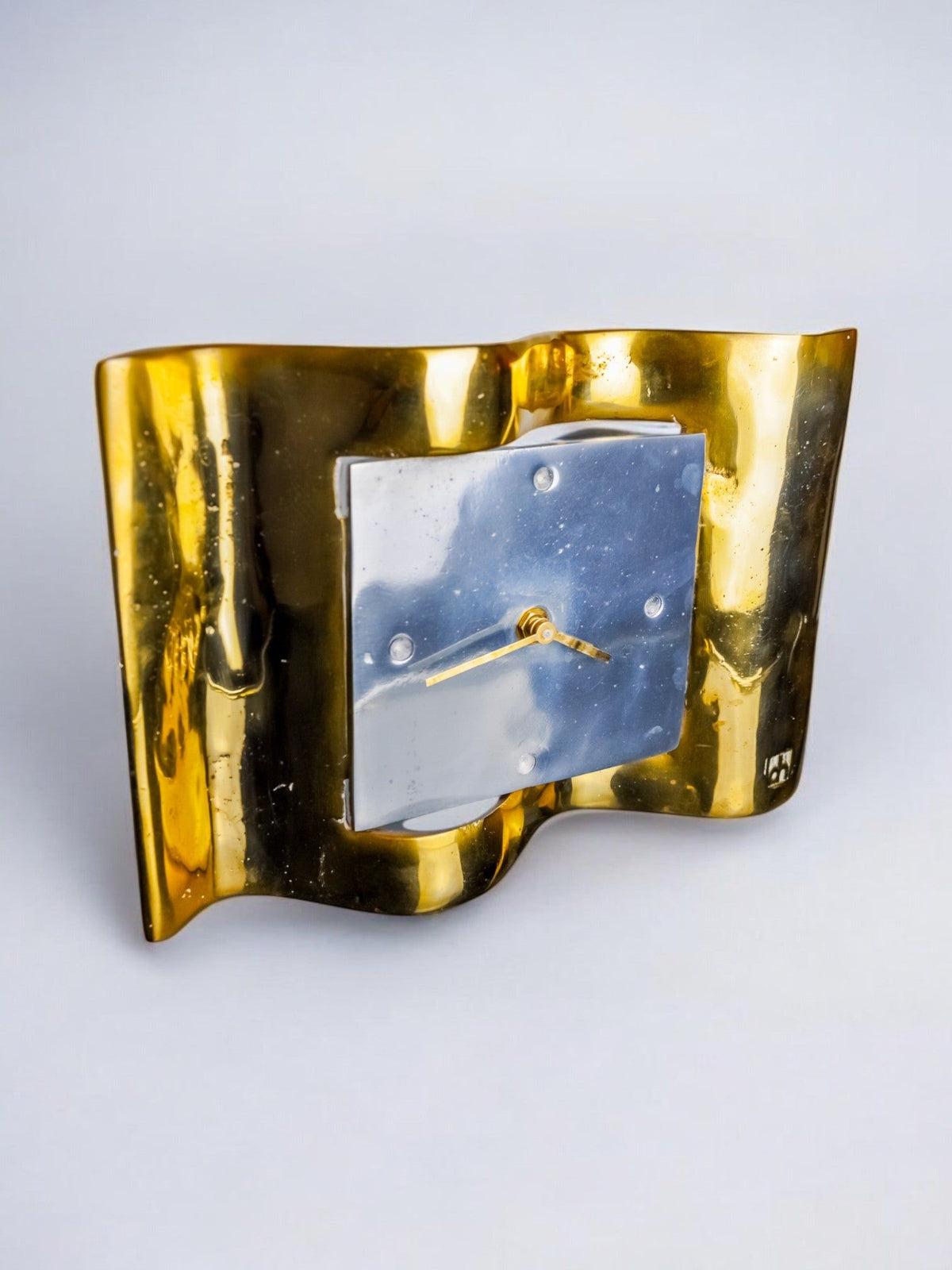 Brutalist Clock by David Marshall, 1970s, Spain — side angle showing polished brass and silver face