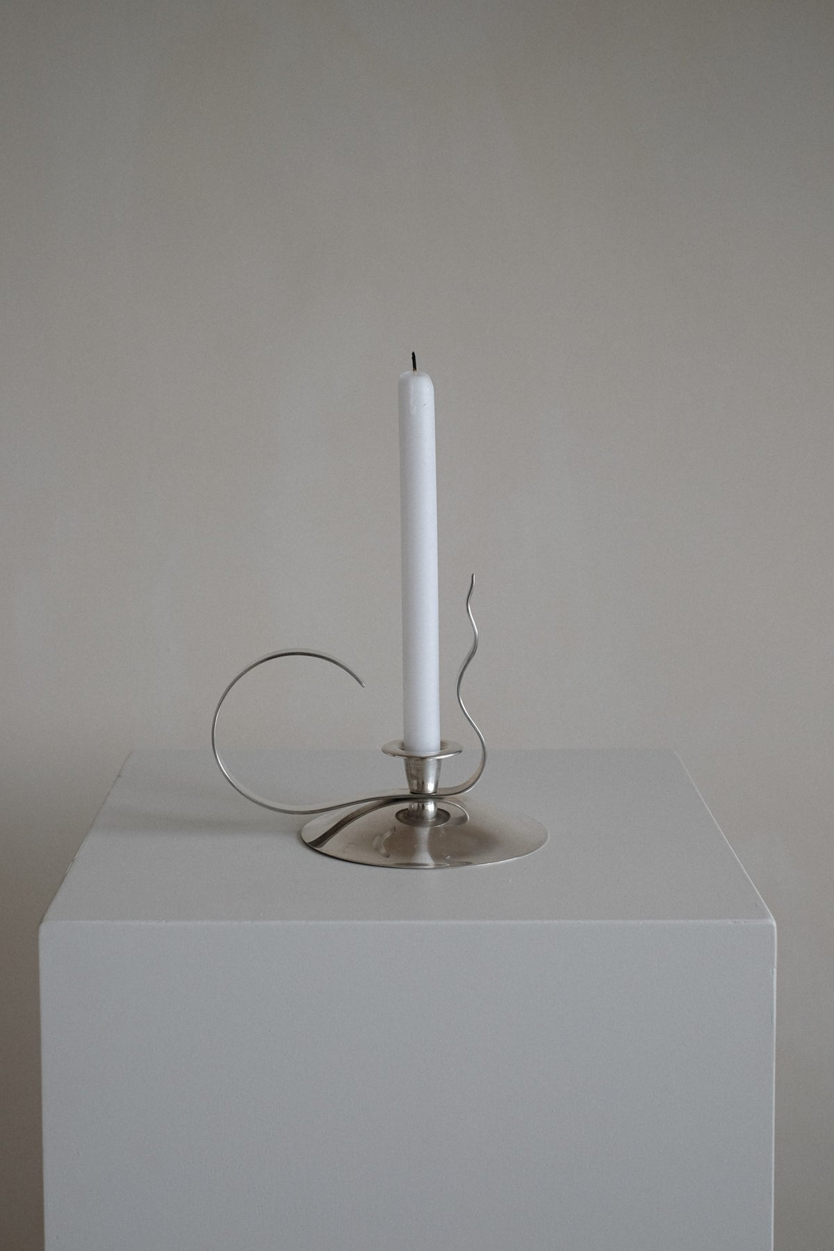 Silver-Plated Candle Holder — angled view on white pedestal