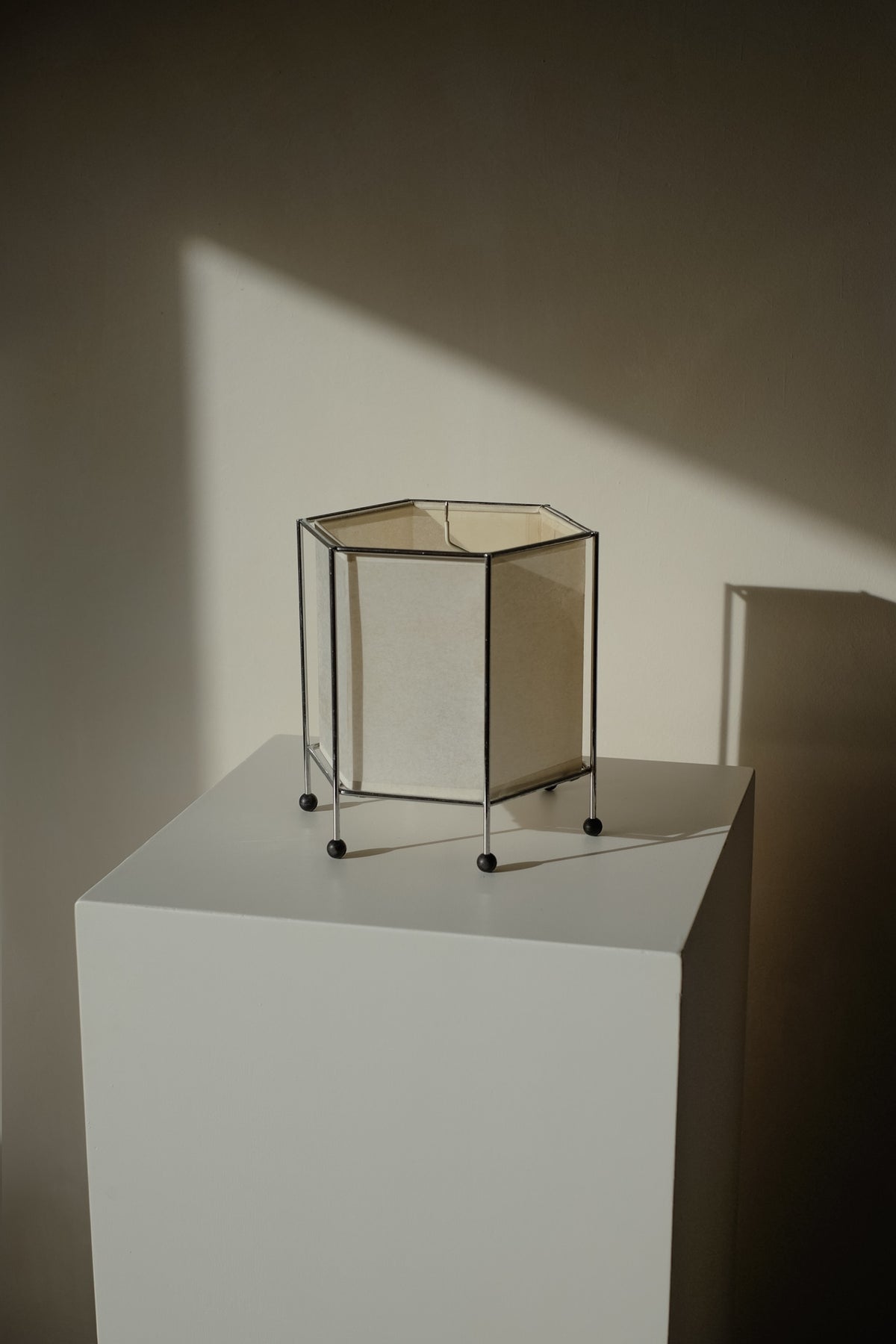 Japanese Rice Paper Table Lamp — back view on white pedestal