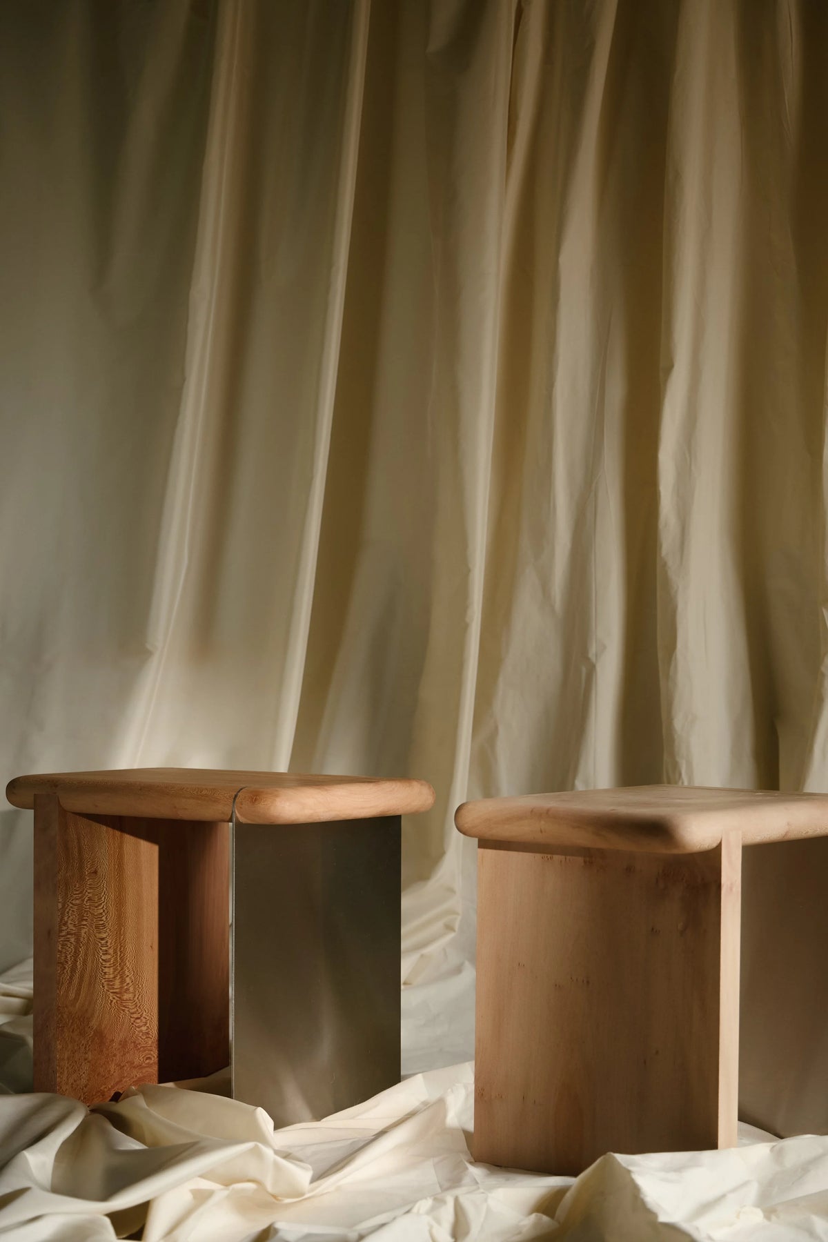 The Ferro Side Table — top view of wooden surface and metal base