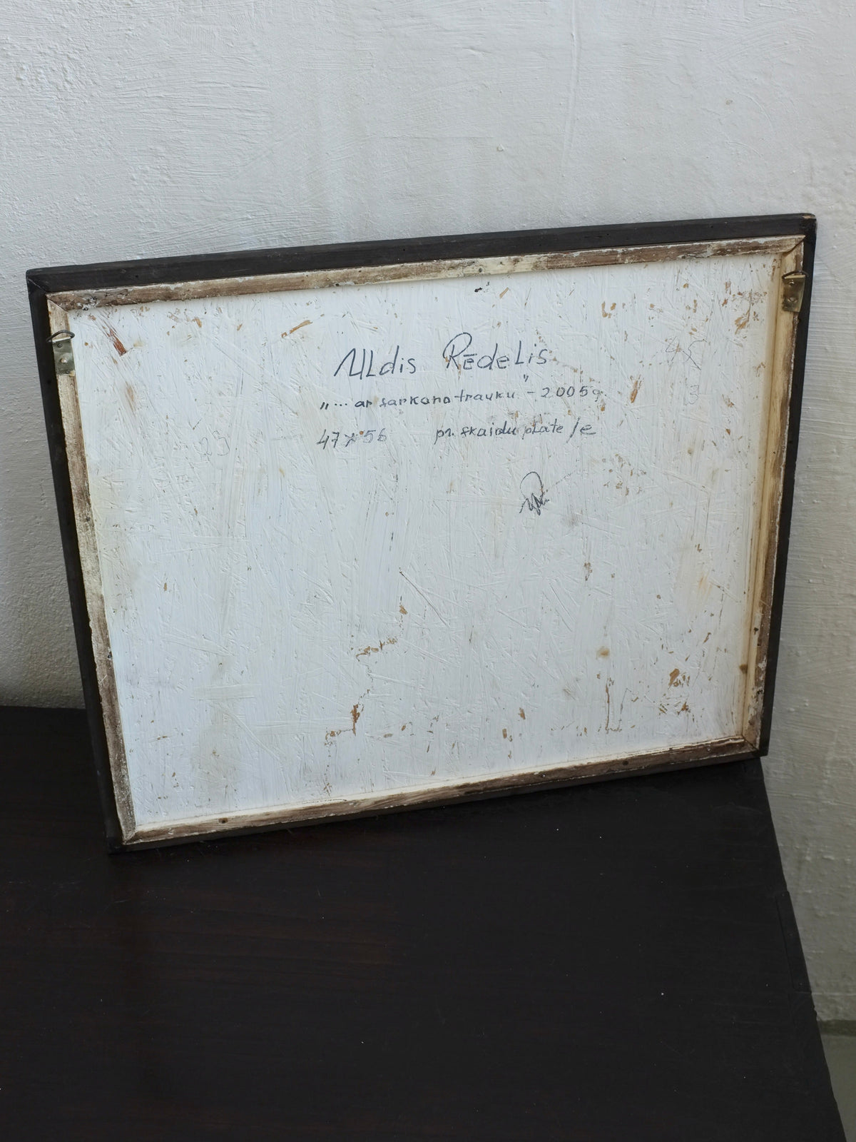 Uldis Rēdelis Still Life Painting "With Red Vessel" | Latvia | 2005 — back view showing wooden frame and signature