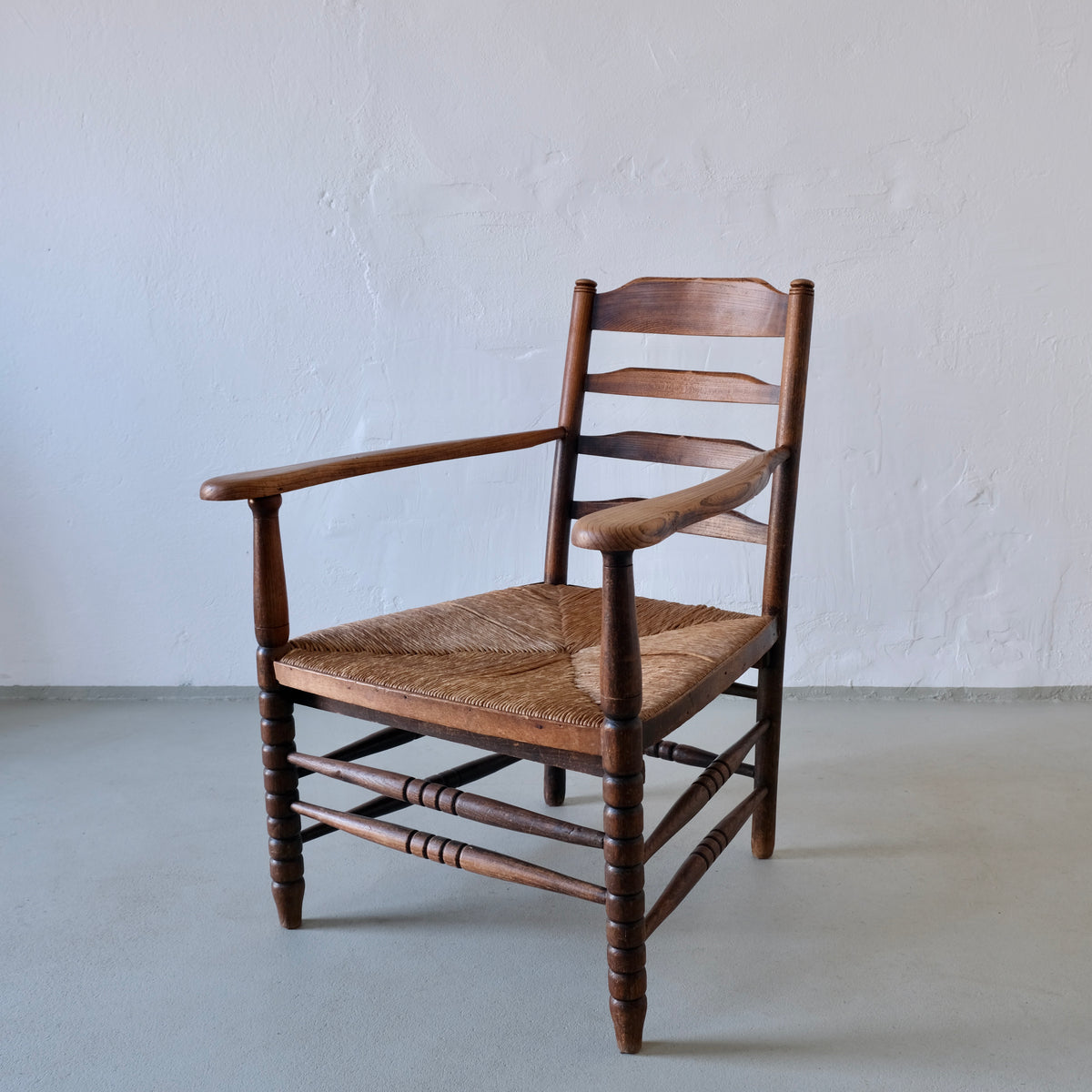 Rustic Bobbin Rush Seat Low Armchair | Netherlands | 1940s by Veter Vintage | The Oblist