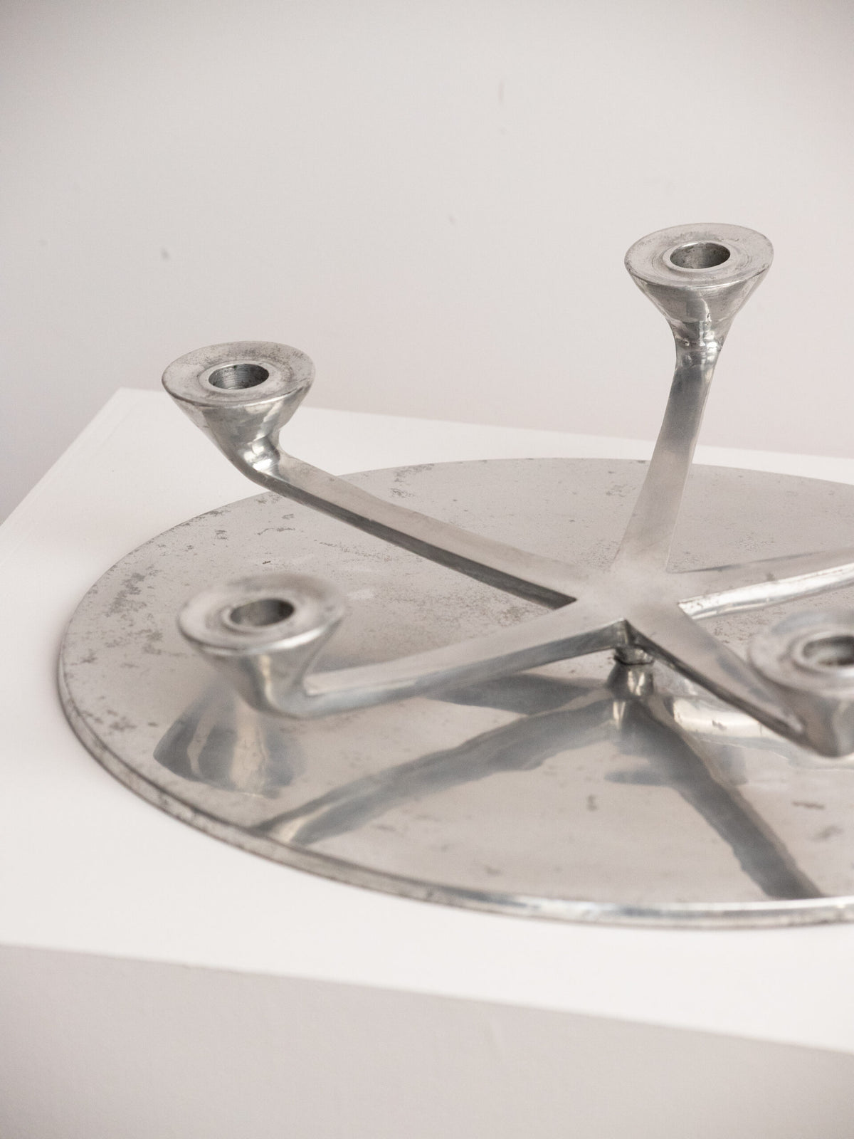 Rotating Five Arm Star Candleholder in Sand Cast Aluminium, Brutalist Europe 1960s to 1970s — side angle