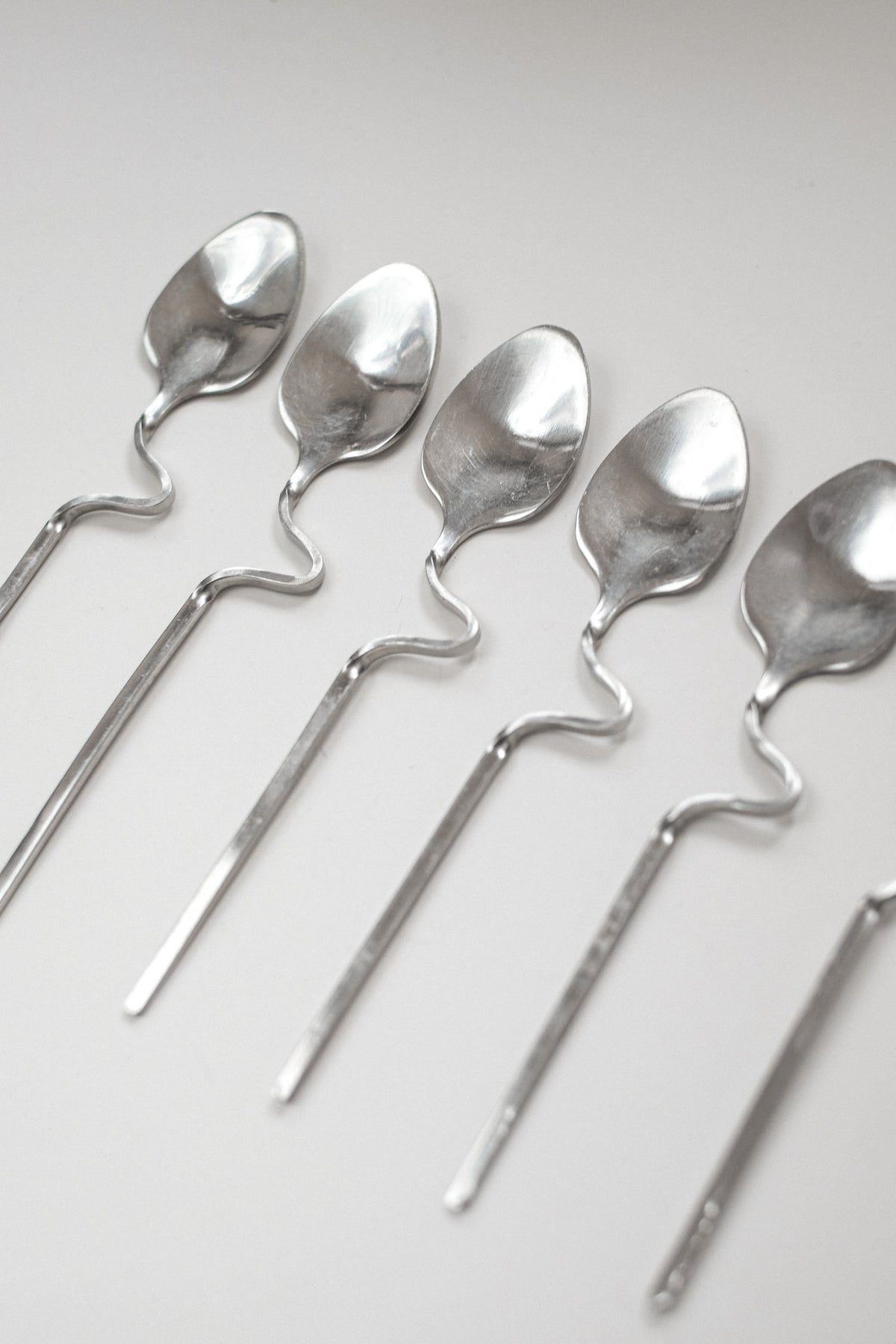 Zigzag Cutlery Set — side angle of handcrafted silver spoons