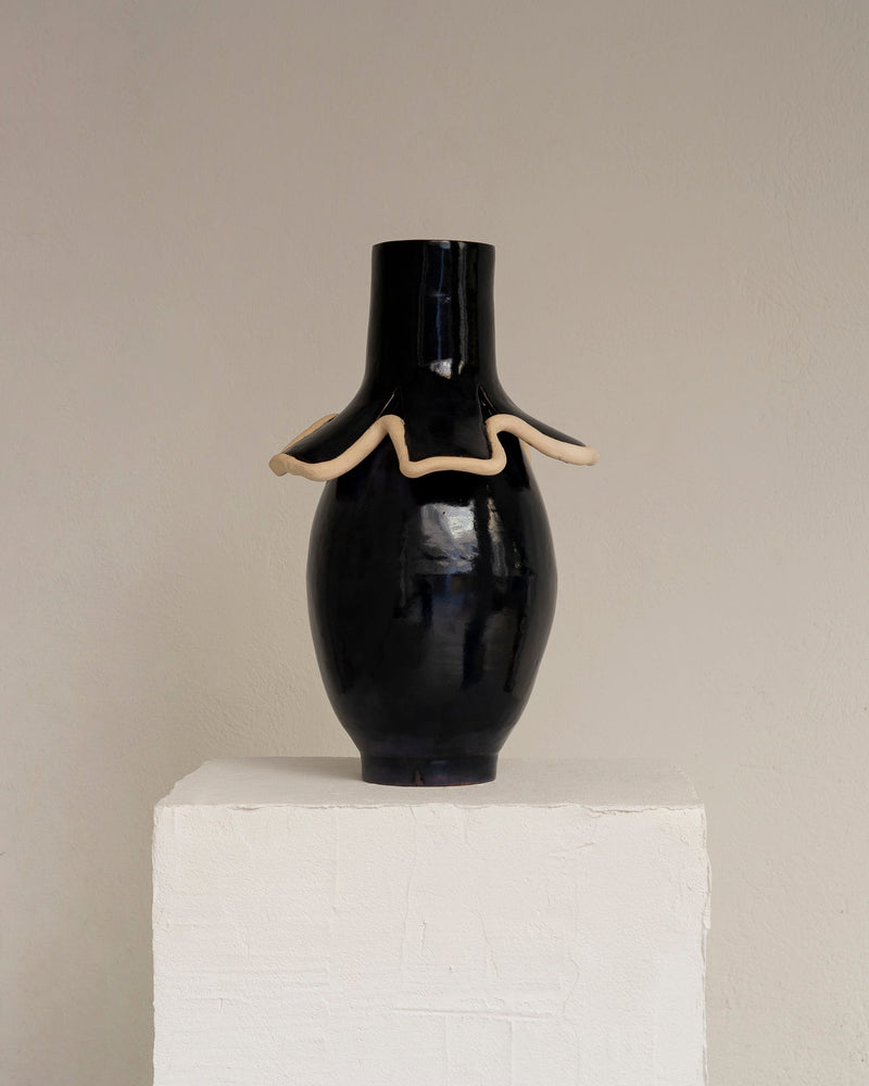 Navy blue glazed ceramic vase with undulating cream clay collar