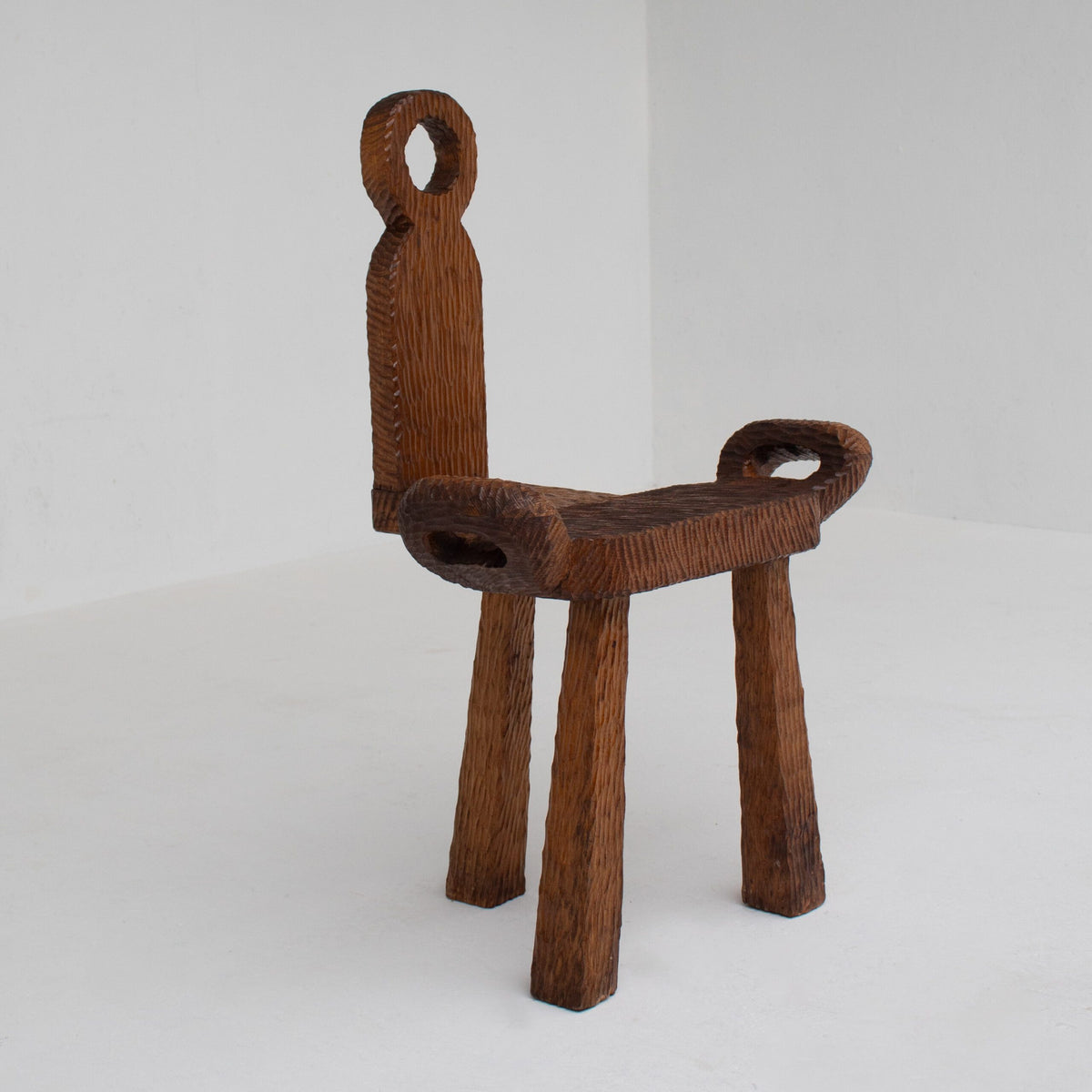 Brutalist Wooden Chair — top view of textured brown wooden seat