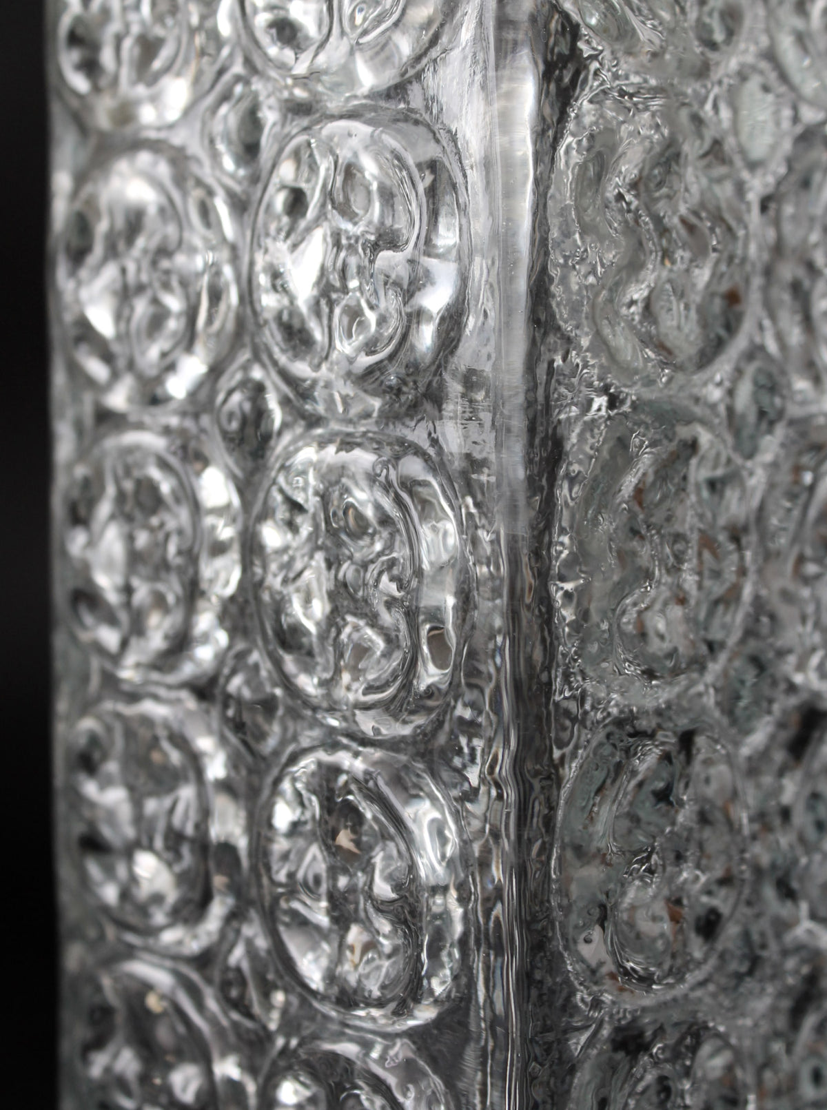 Textured glass surface detail of Czech crystal vase showing relief