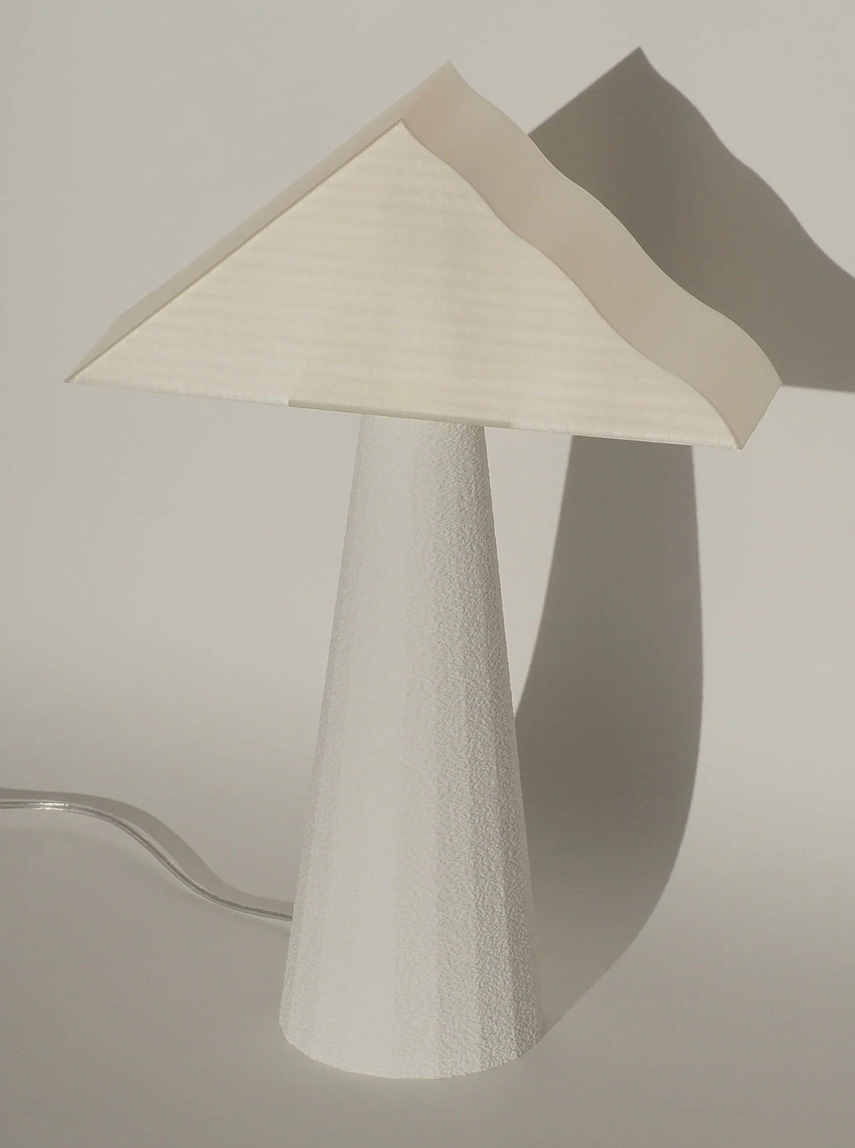 Cloud Lamp — angled view with textured white base and shade