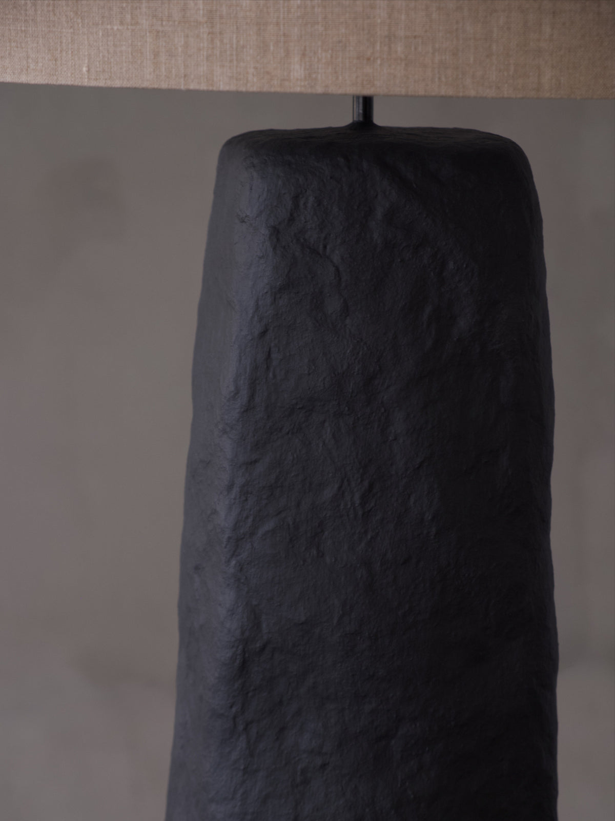 Skelia Sculptural Floor Lamp — close-up of textured black base