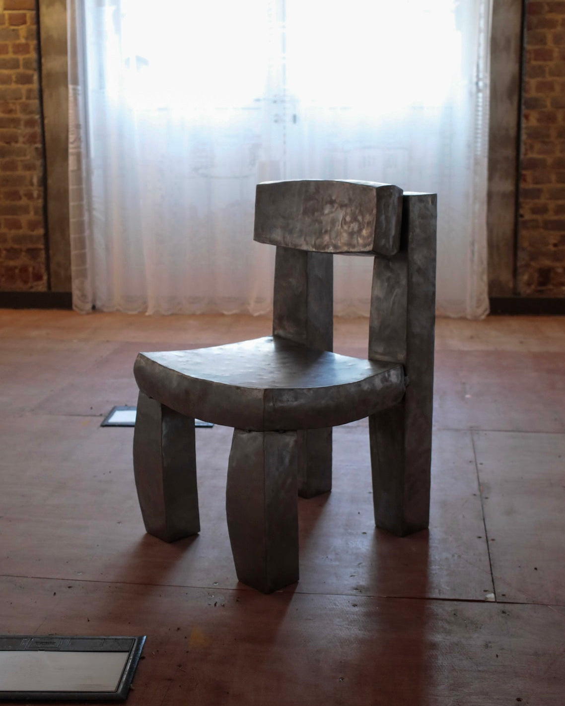 Sculptural Joe wooden chair with curved back and chunky legs by Jesse Butterfield