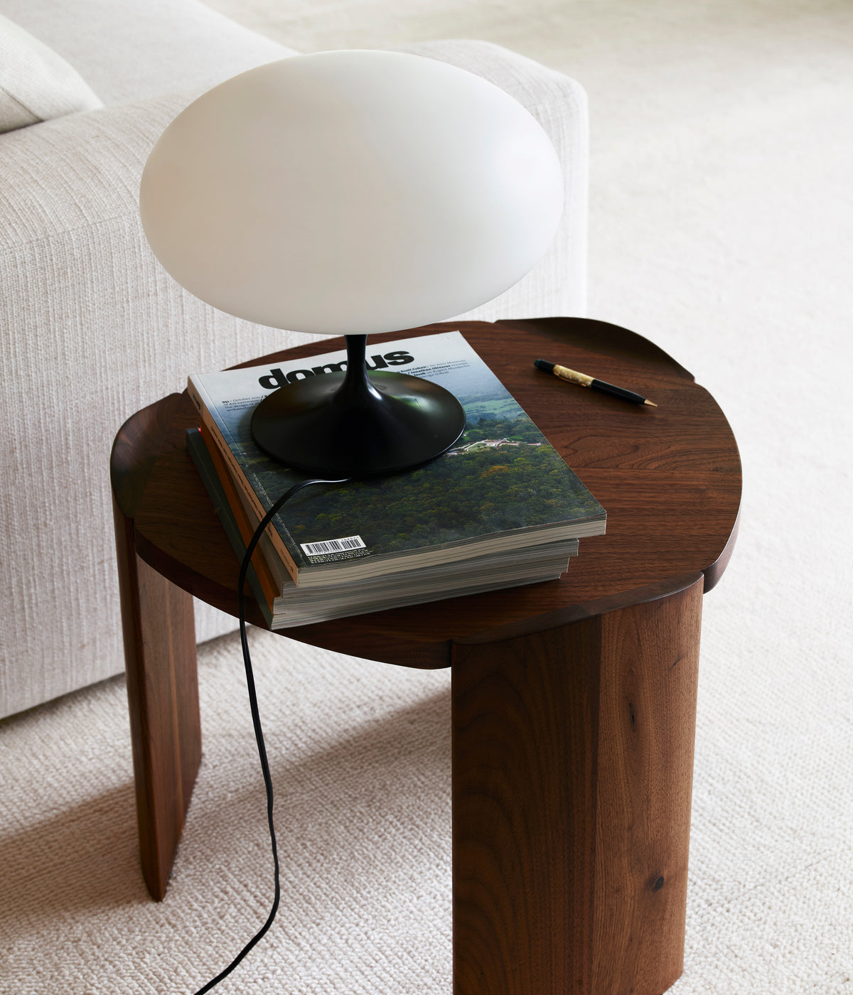 Pryn walnut end table with mushroom lamp and magazine styling
