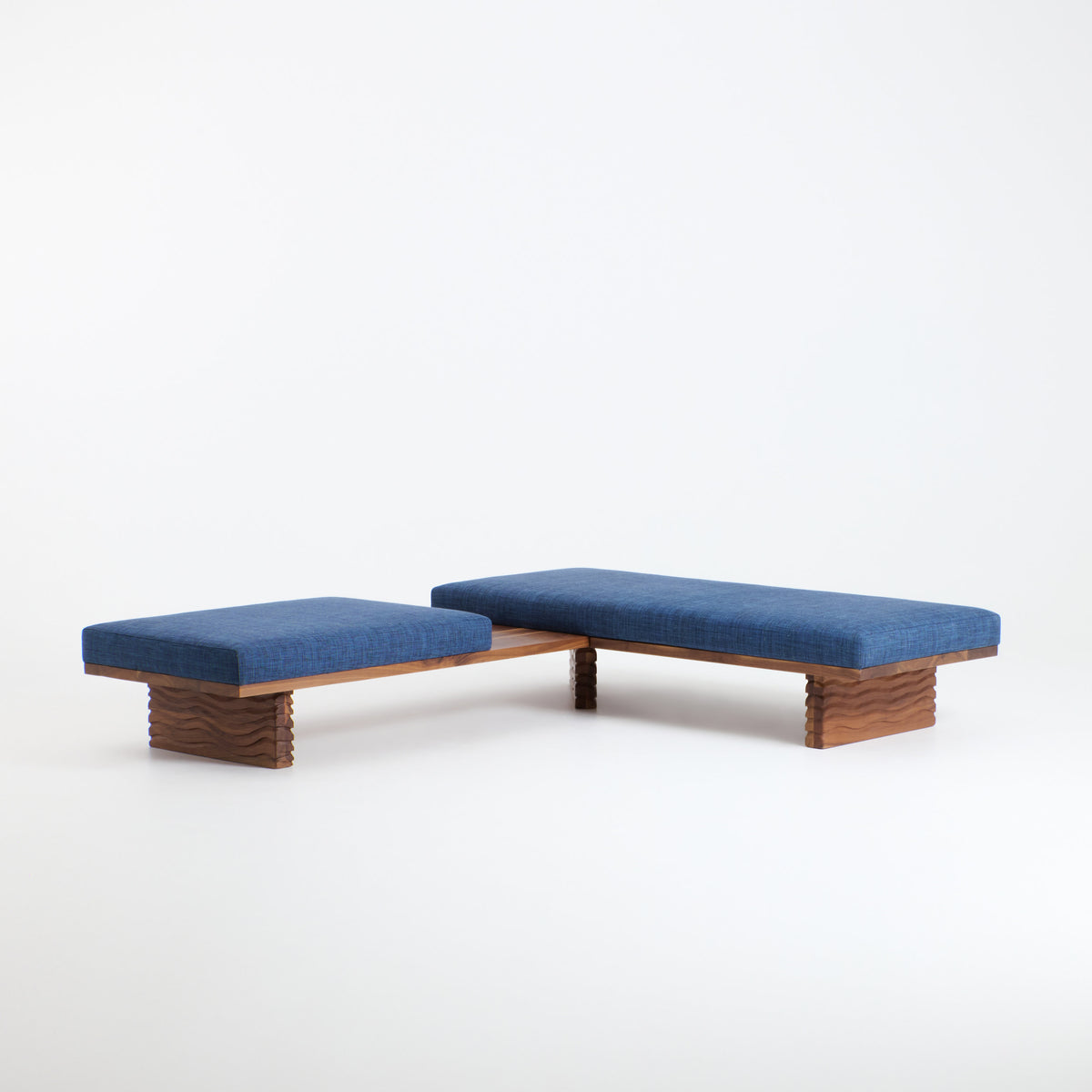 Nazaré Daybed L Shape — side angle showing blue upholstery and wooden base