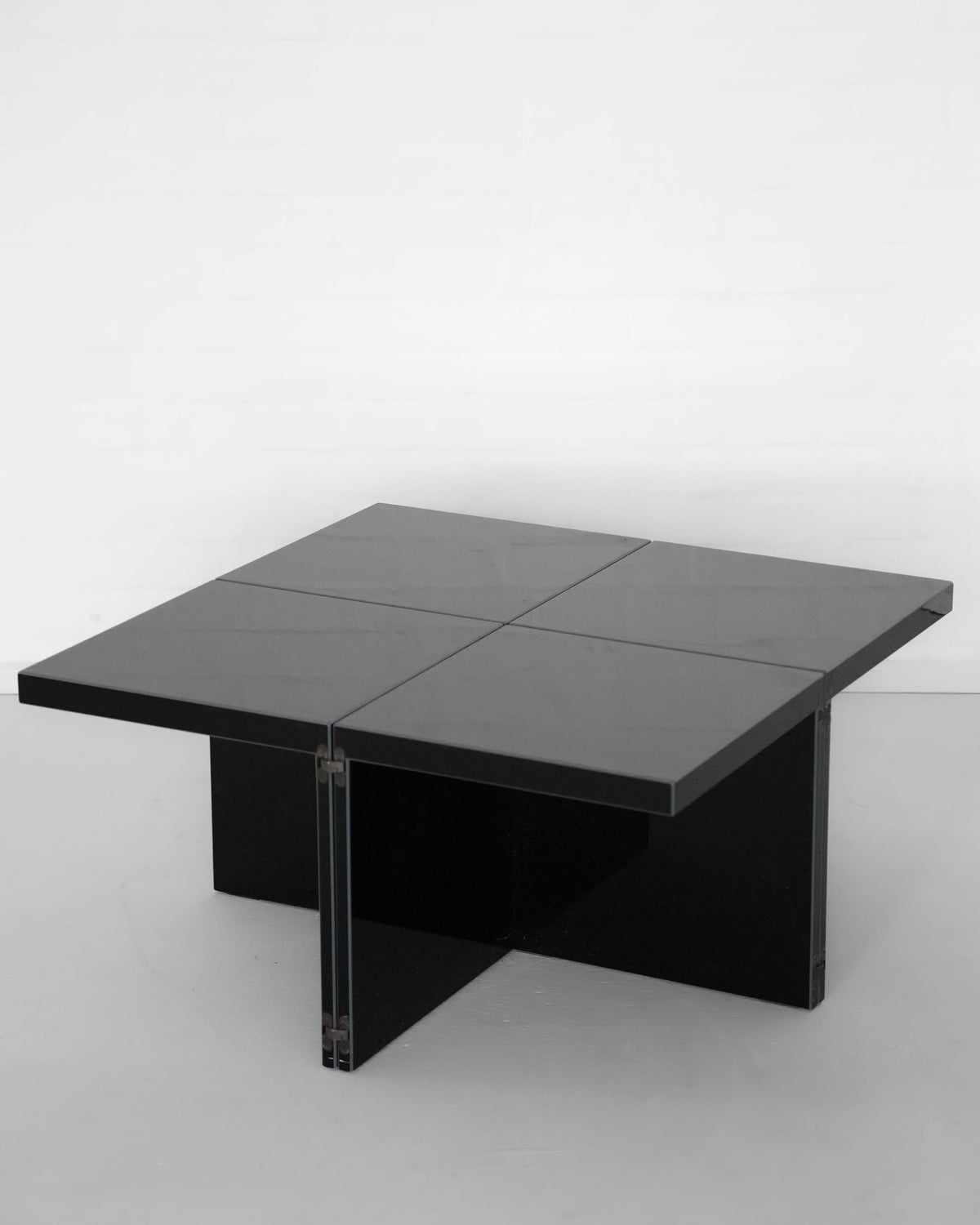 Black lacquered Domino side table with geometric modular design