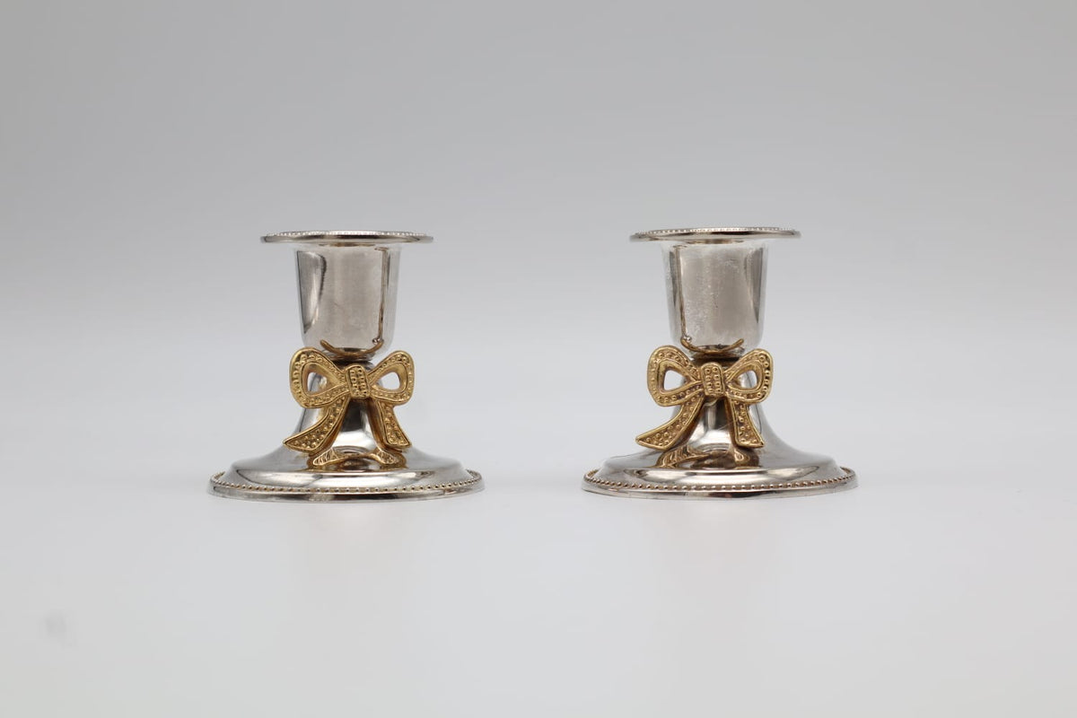 Pair of Vintage Silver-Plated Candlesticks with Gilt Bow Accents — detail view
