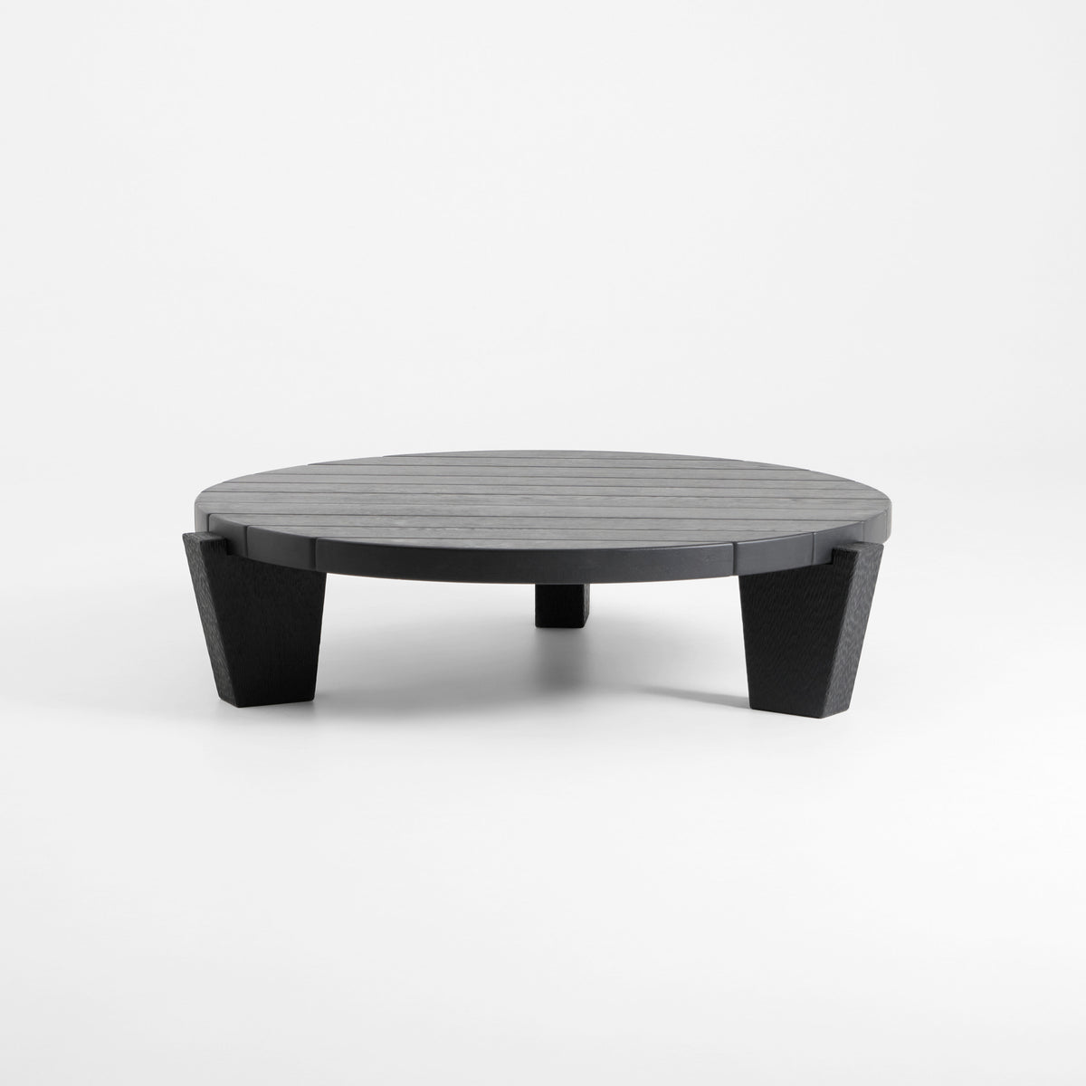 Peniche Coffee Table in Oak — front view with round shape and textured legs