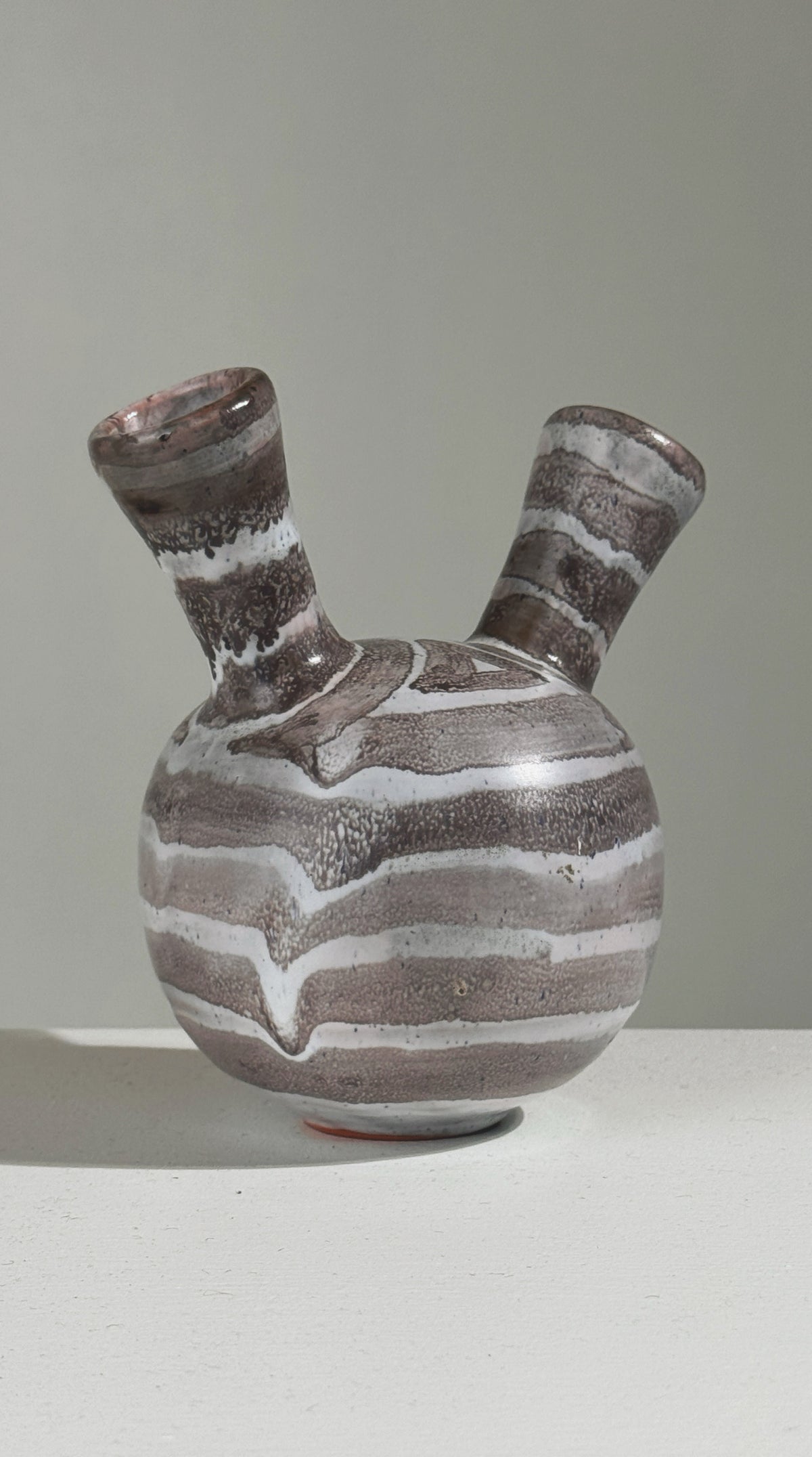 Double-neck ceramic vase with brown and white striped pattern
