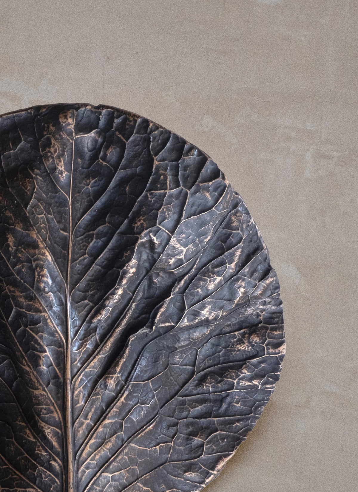 Bronze cabbage leaf wall light texture detail showing intricate veining