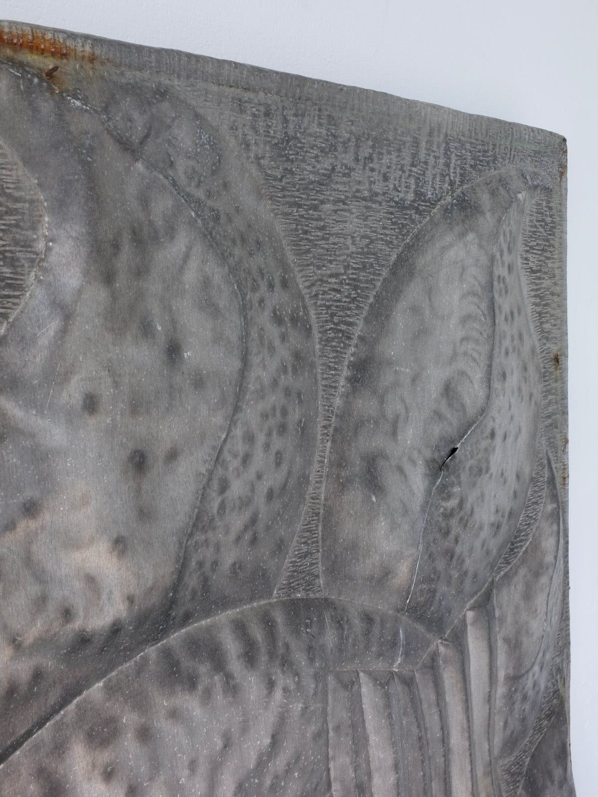 Textured surface detail of Latvian brutalist metal relief sculpture