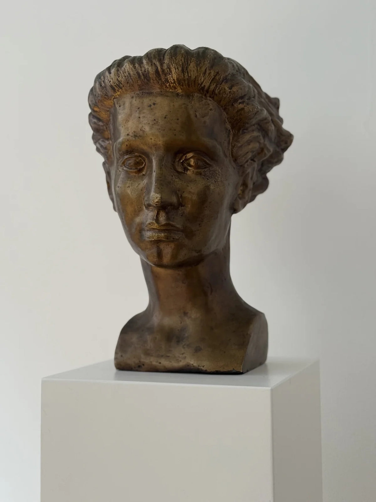 Bronze Sculpture by Sigge Berggren — side angle on white pedestal