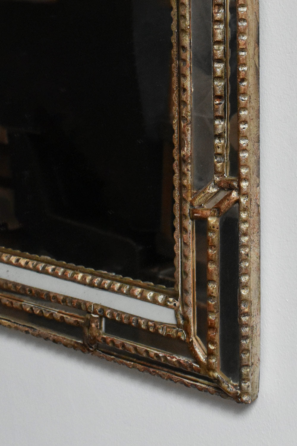 Giltwood and Patinated-wood Mirror, 1940s — angled view highlighting detailed frame texture