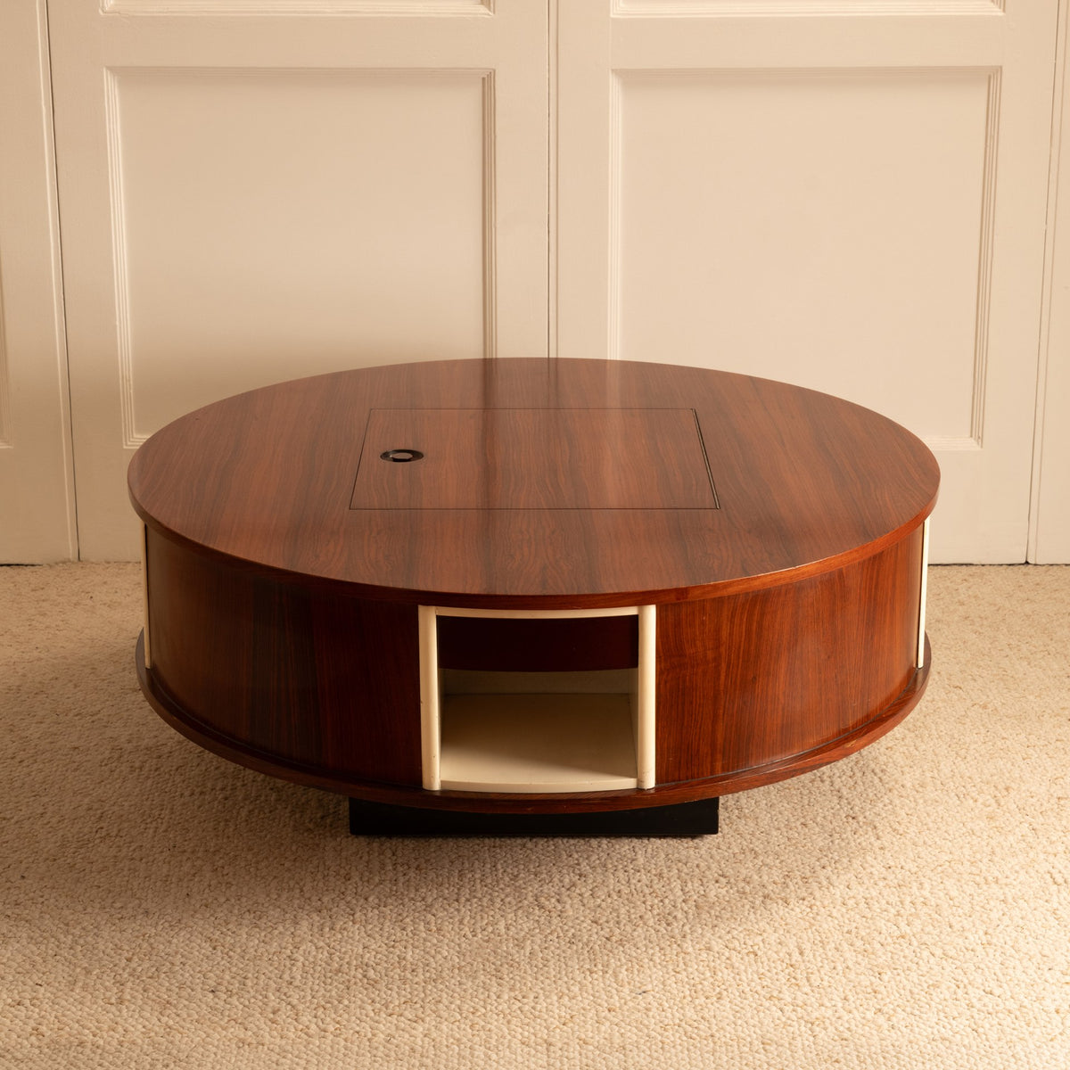 Swivel Coffee Table — top view of round wooden table with storage